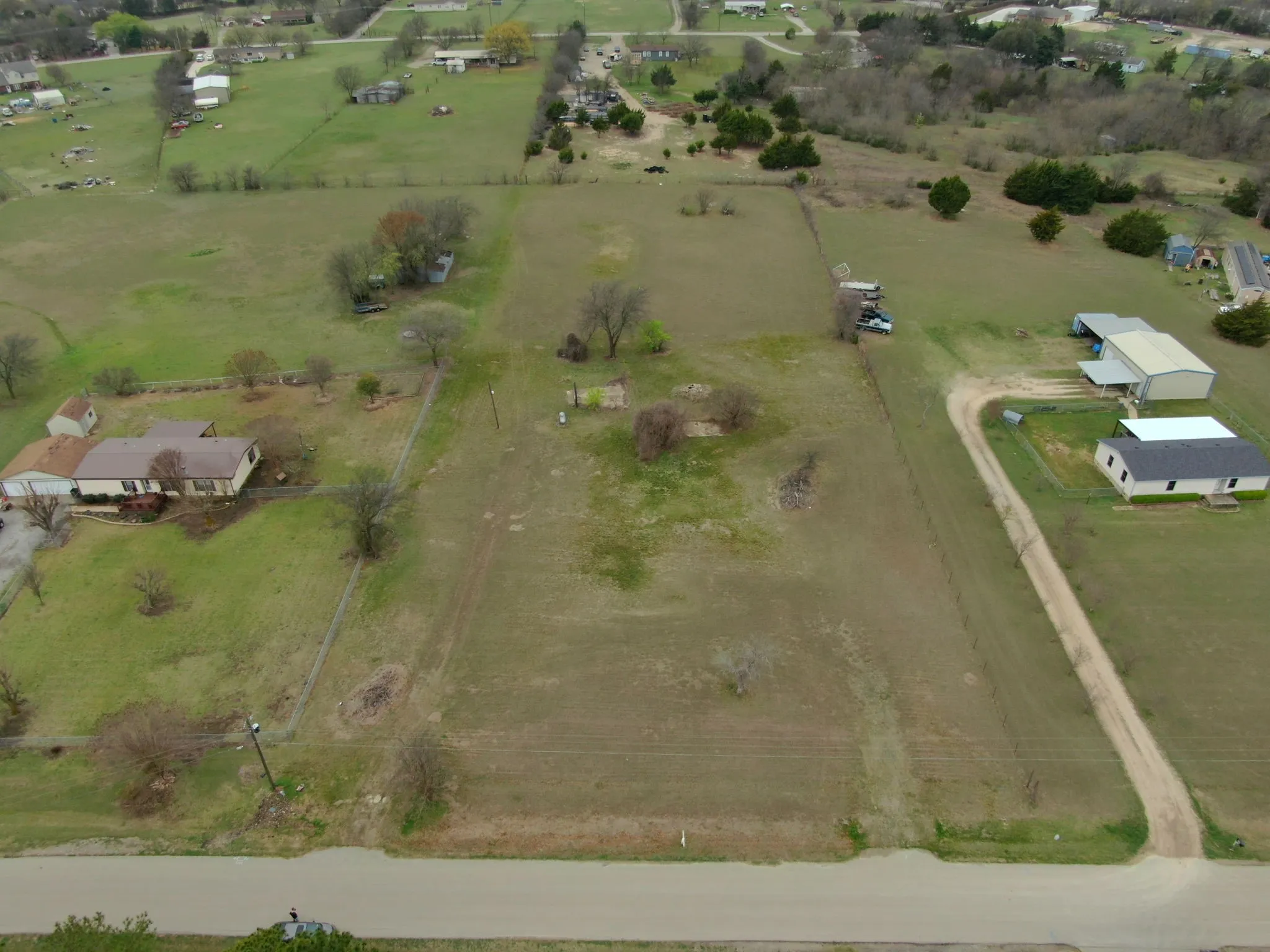 Aerial view of property's location featuring rural landscape and agricultural land