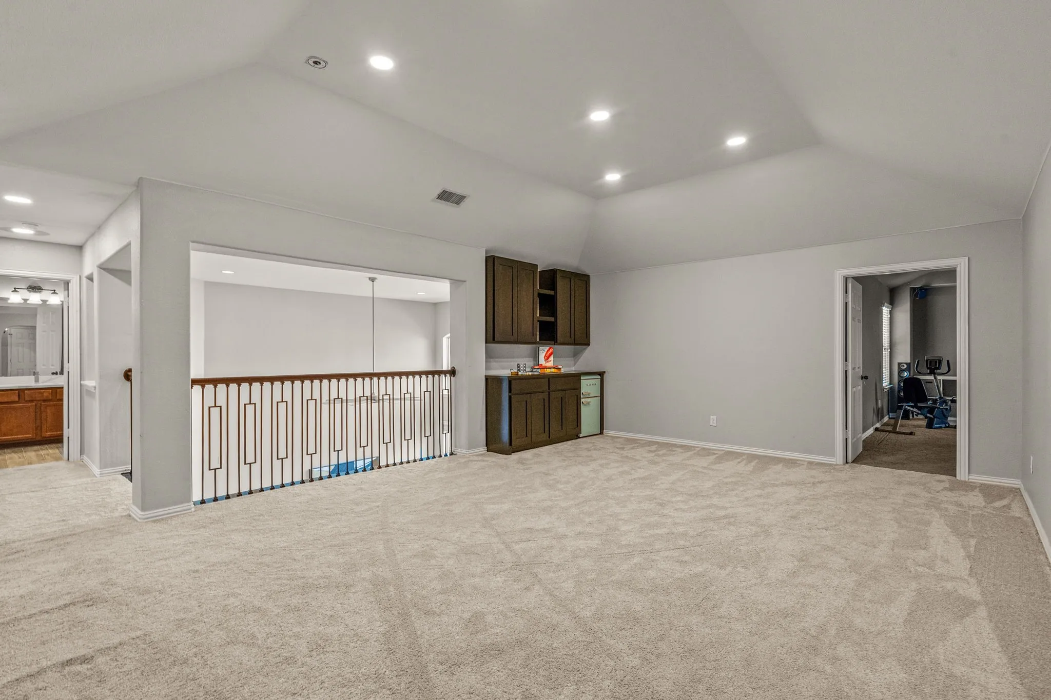 Game room with recessed lighting and light carpet
