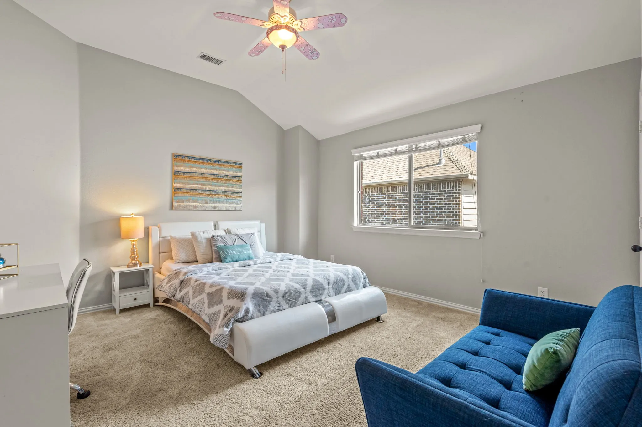 Bedroom featuring lofted ceiling, carpet, and ceiling fan