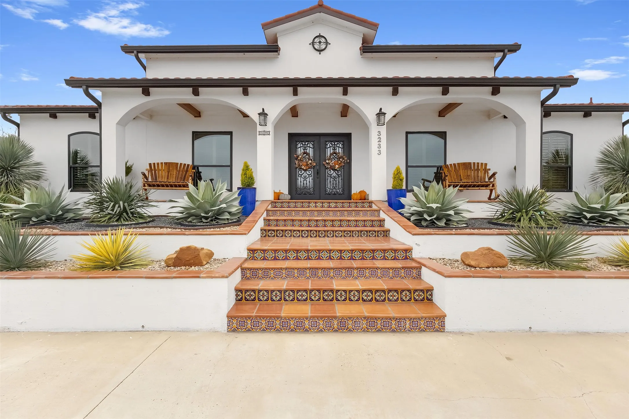VIEW OF THE FRONT ENTRY CAS-IRON DOUBLE DOOR