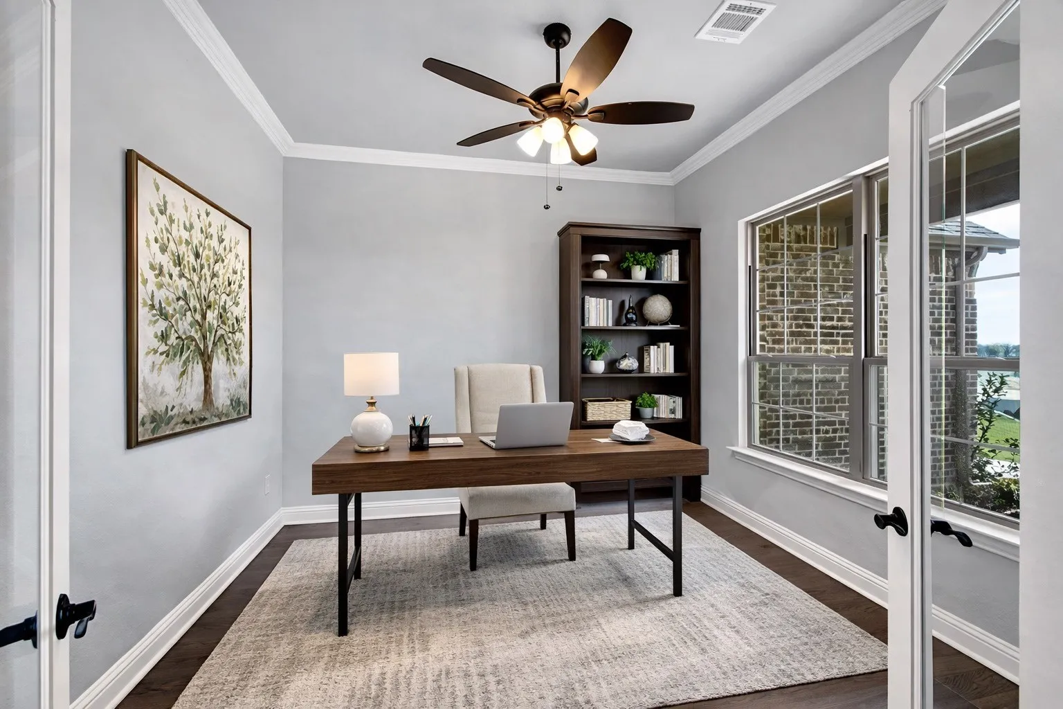 Dedicated home office with French doors—ideal for remote work or flex space. Virtually staged.