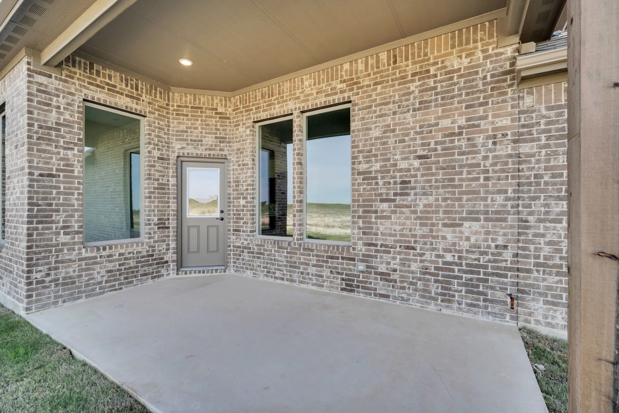 Covered outdoor living space perfect for morning coffee or evening relaxation.