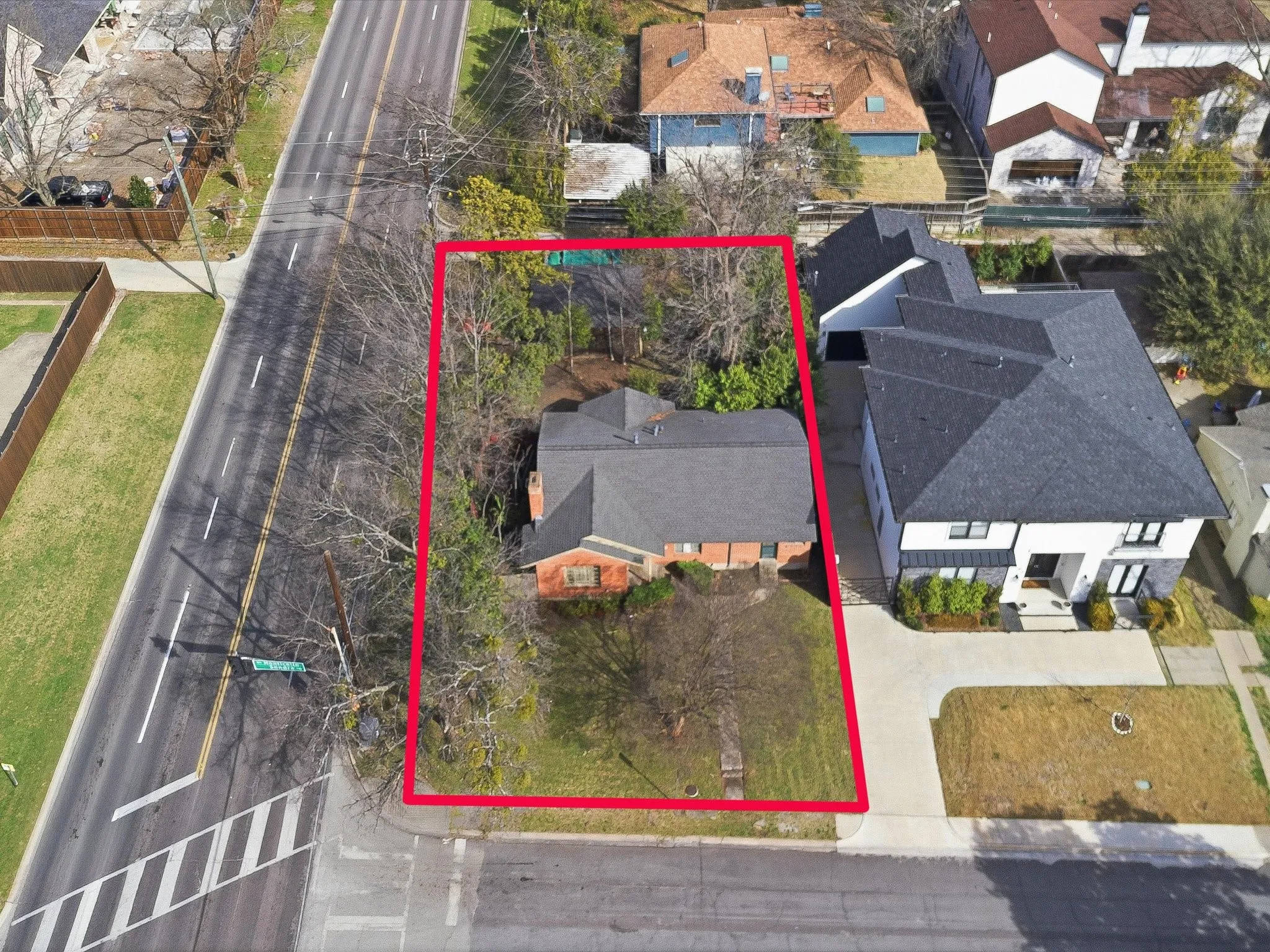 Aerial view of residential area with property parcel outlined