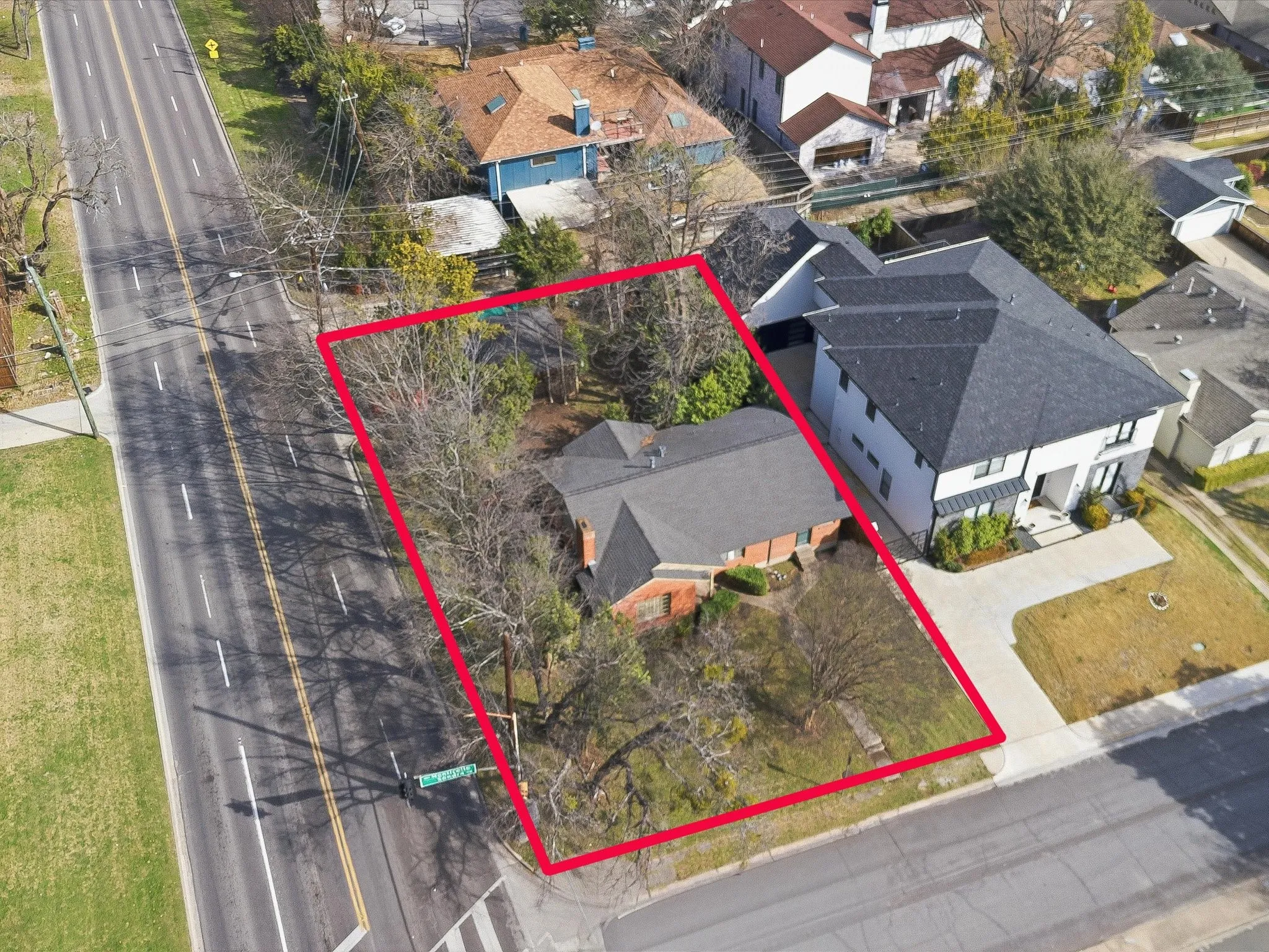 Aerial perspective of suburban area with property parcel outlined