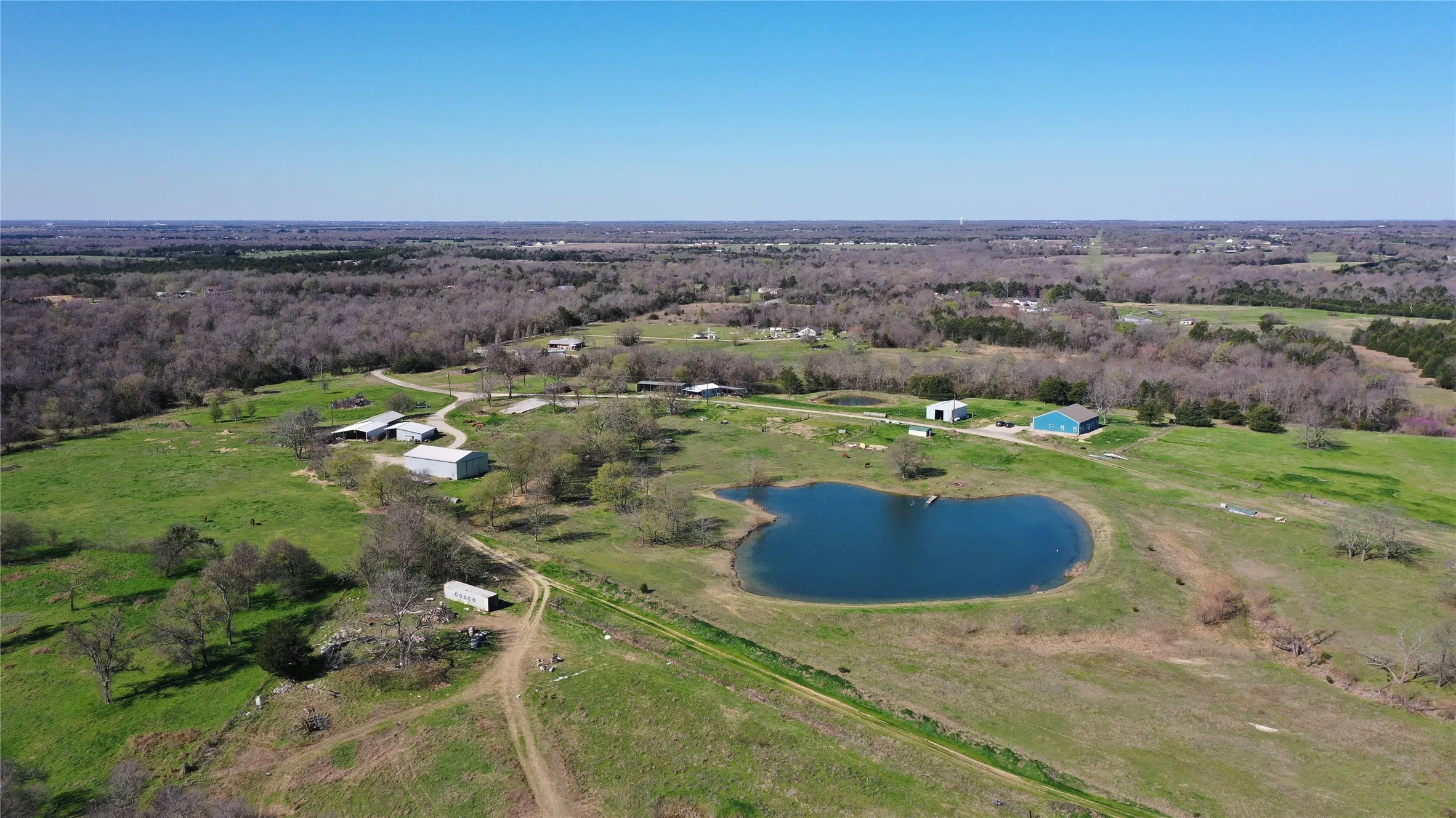 Drone / aerial view featuring a water view and a rural view