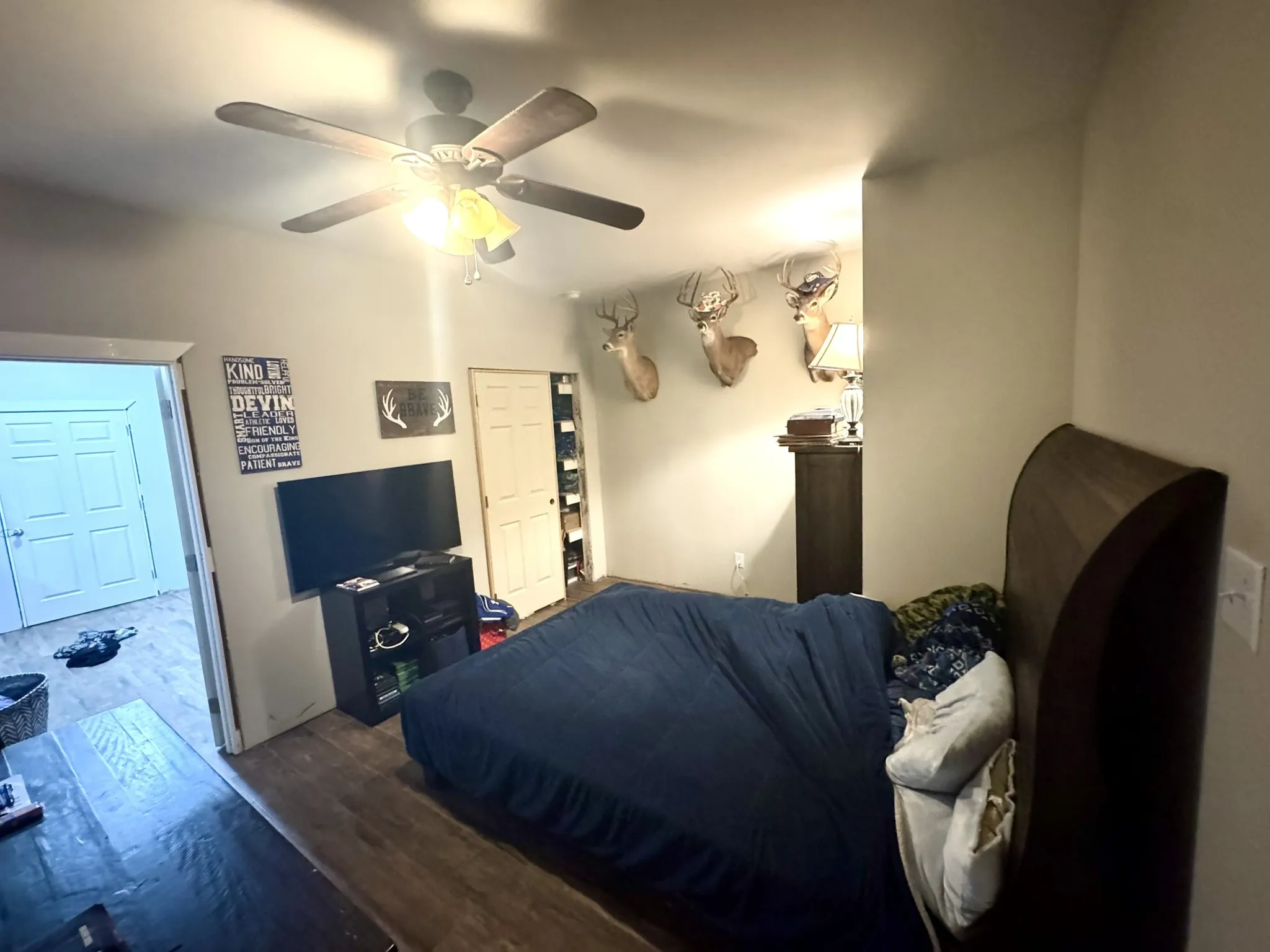 Bedroom with wood finished floors and ceiling fan