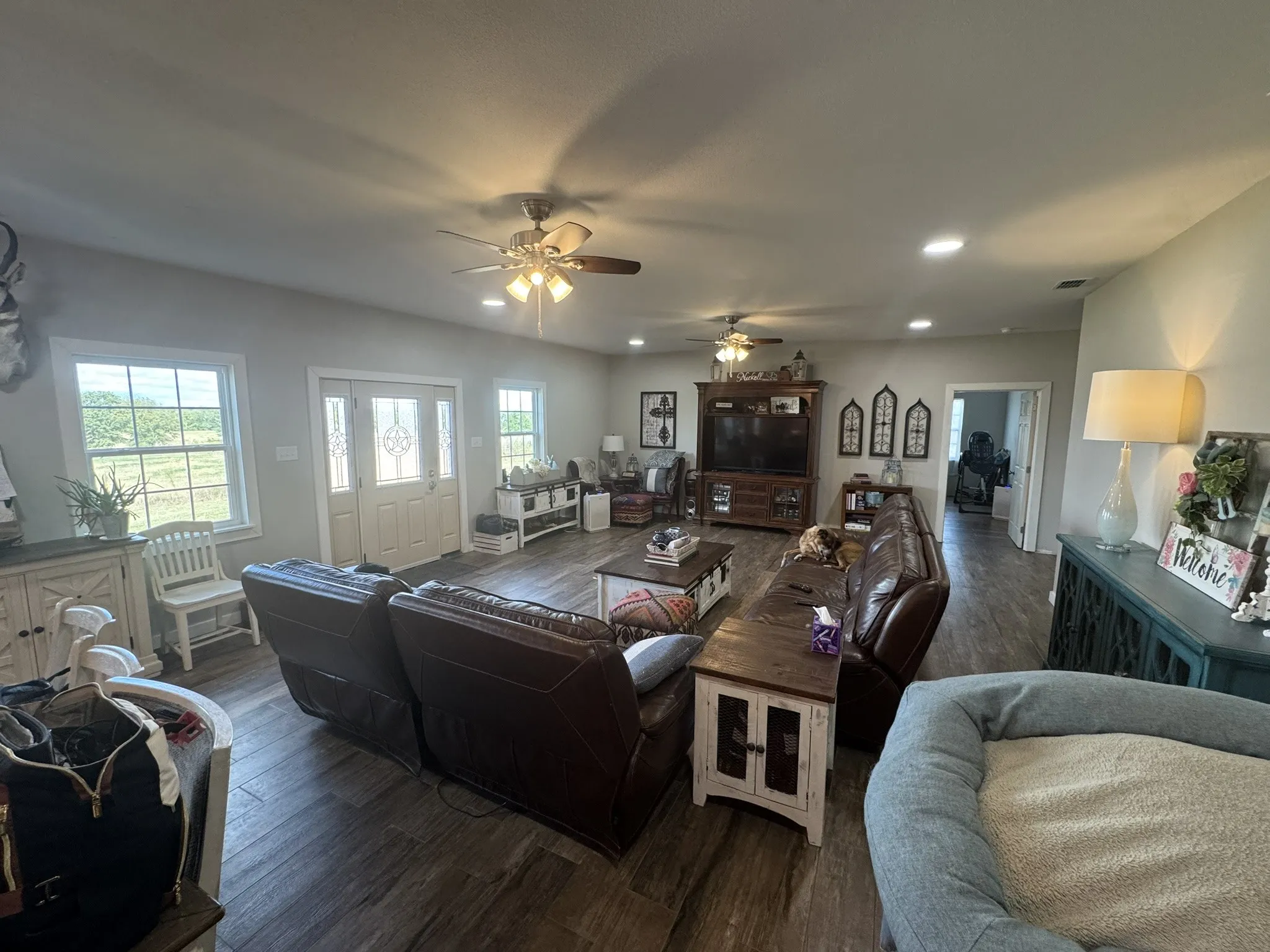 Living area featuring wood finished floors, recessed lighting, and ceiling fan