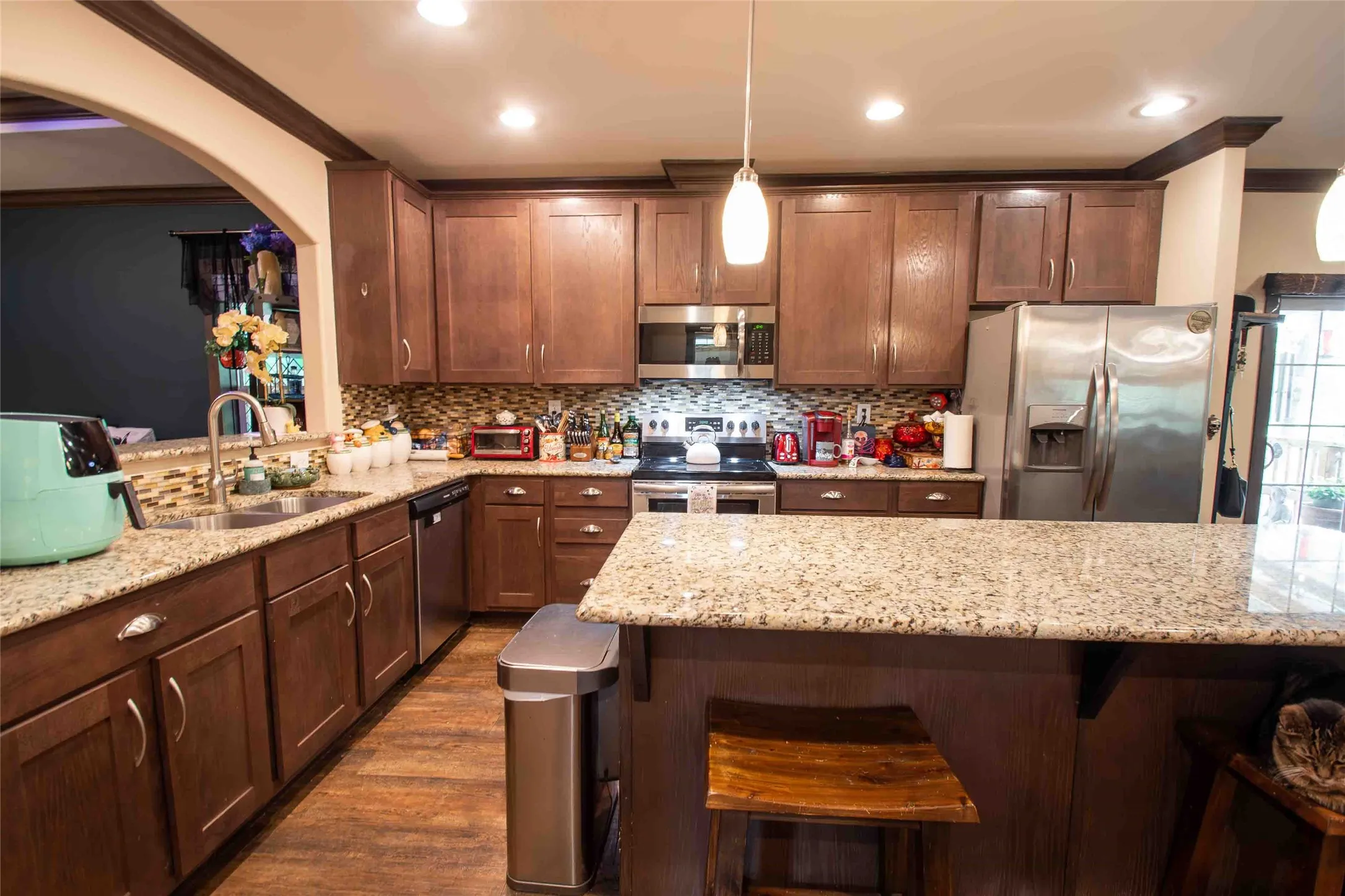 Large kitchen with a lot of cabinet space.