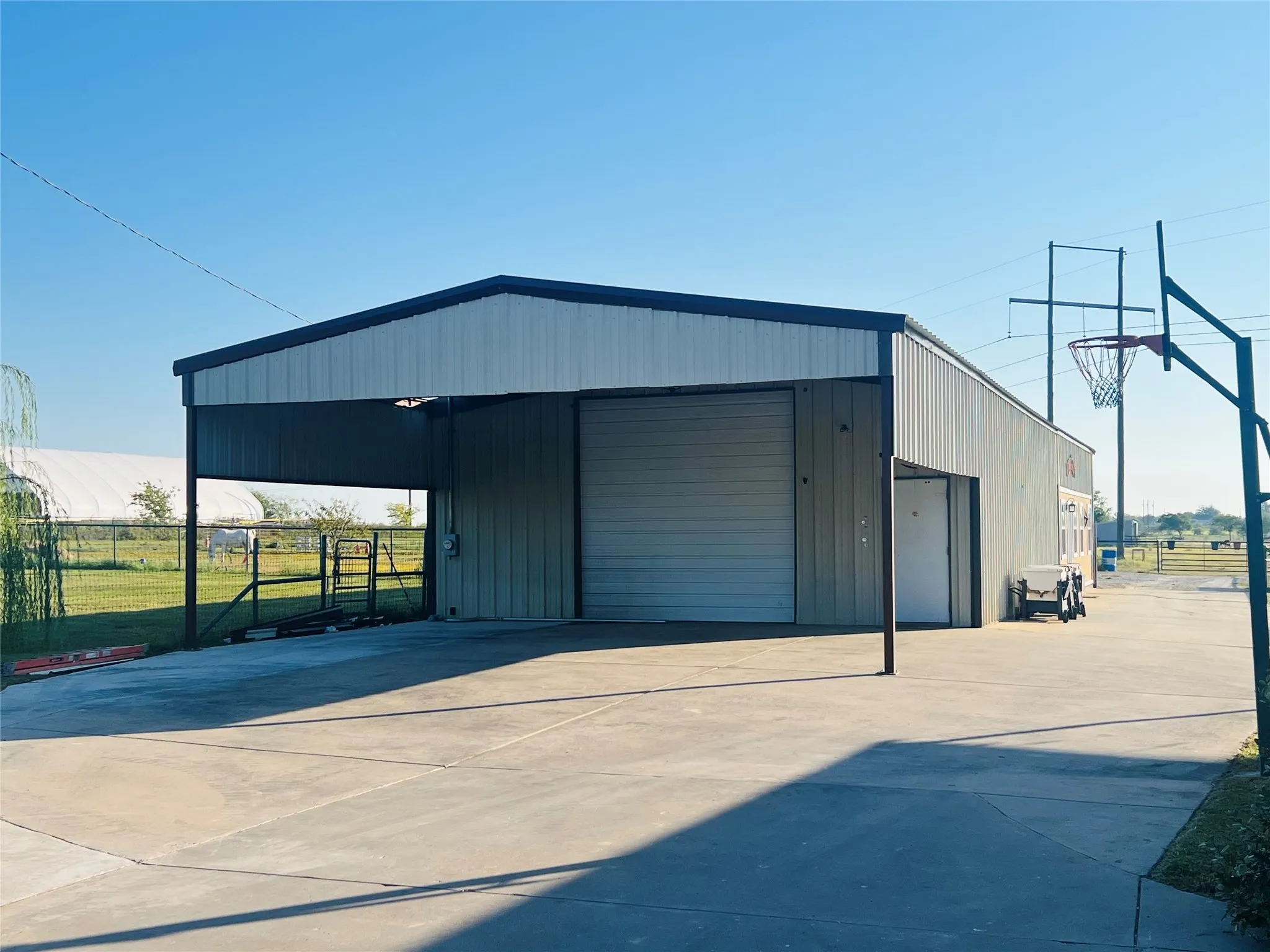 Newly added awning, covered parking for 3 vehicles.