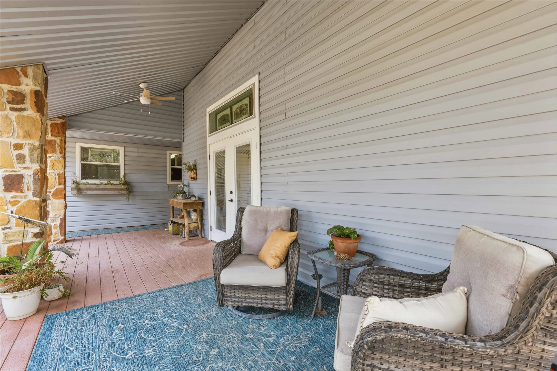 Wooden deck featuring a ceiling fan