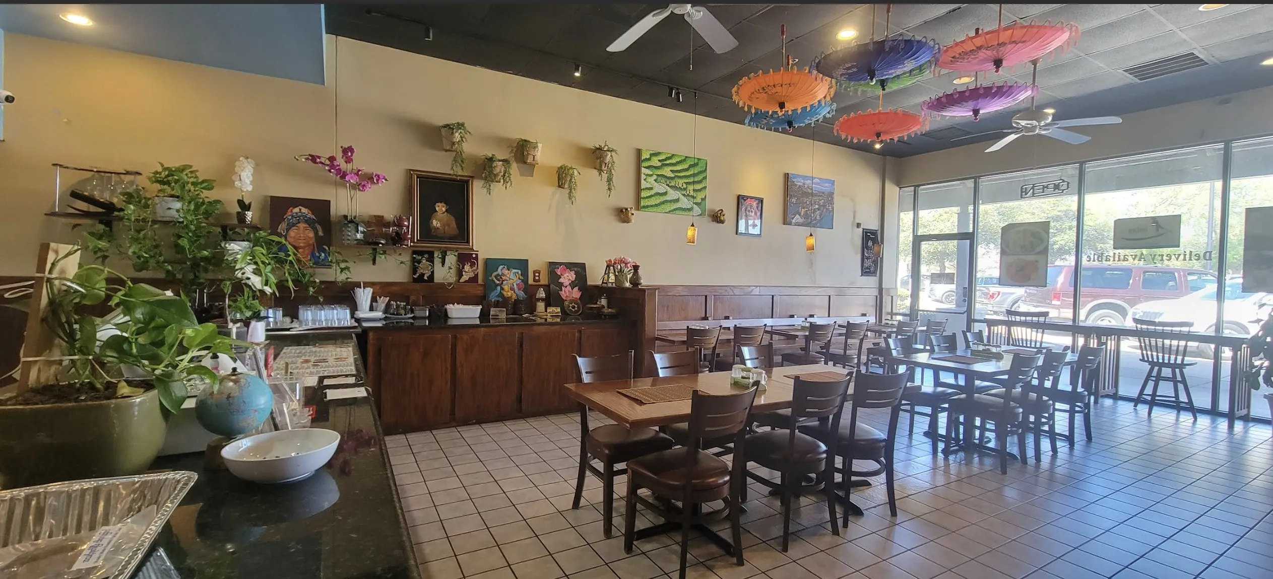 Dining space featuring ceiling fan and light tile patterned floors