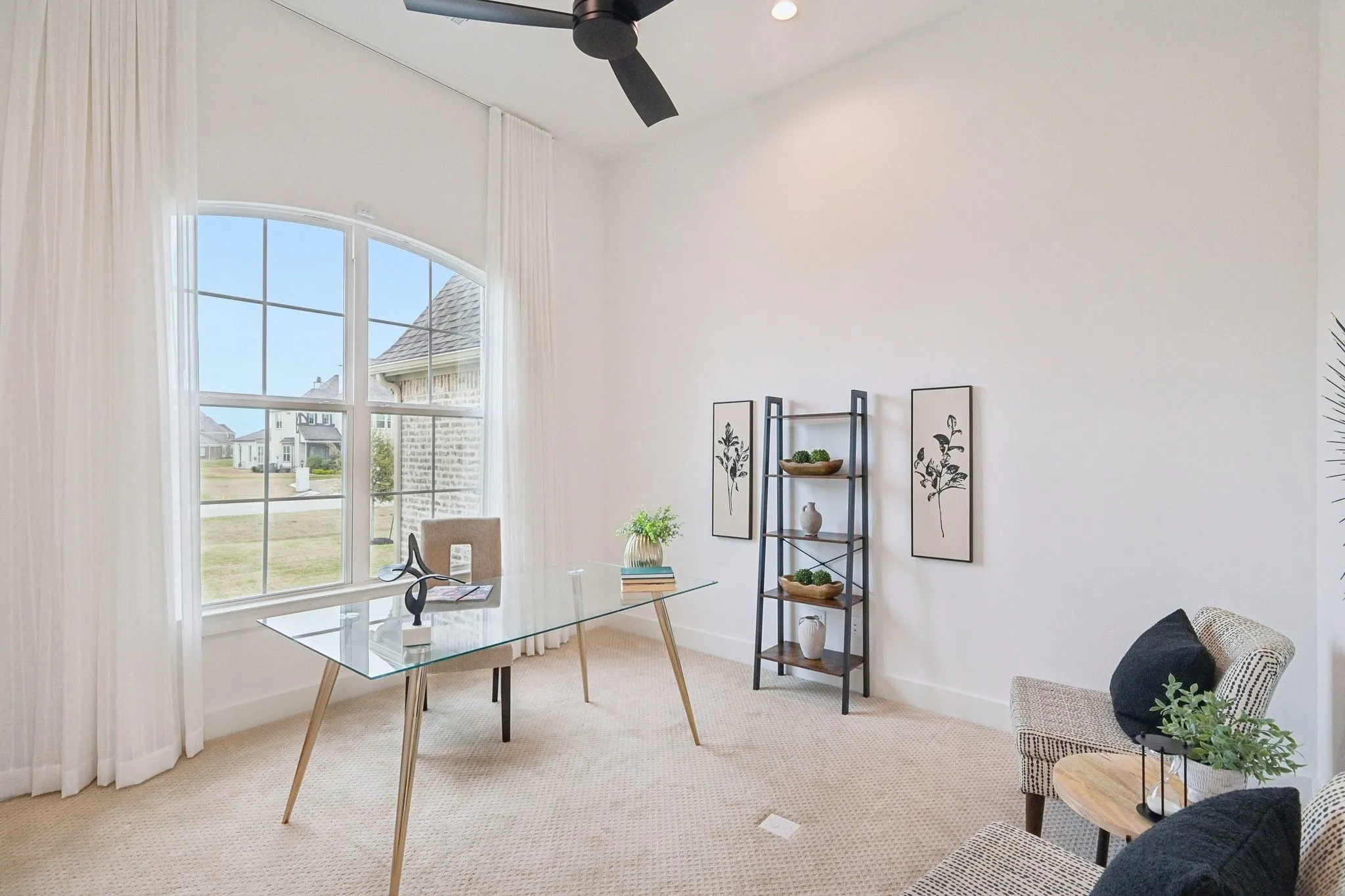 Office with huge windows overlooking the front of the house that allows for great natural light.  Room also has a large closet with shelving, perfect for keeping organized