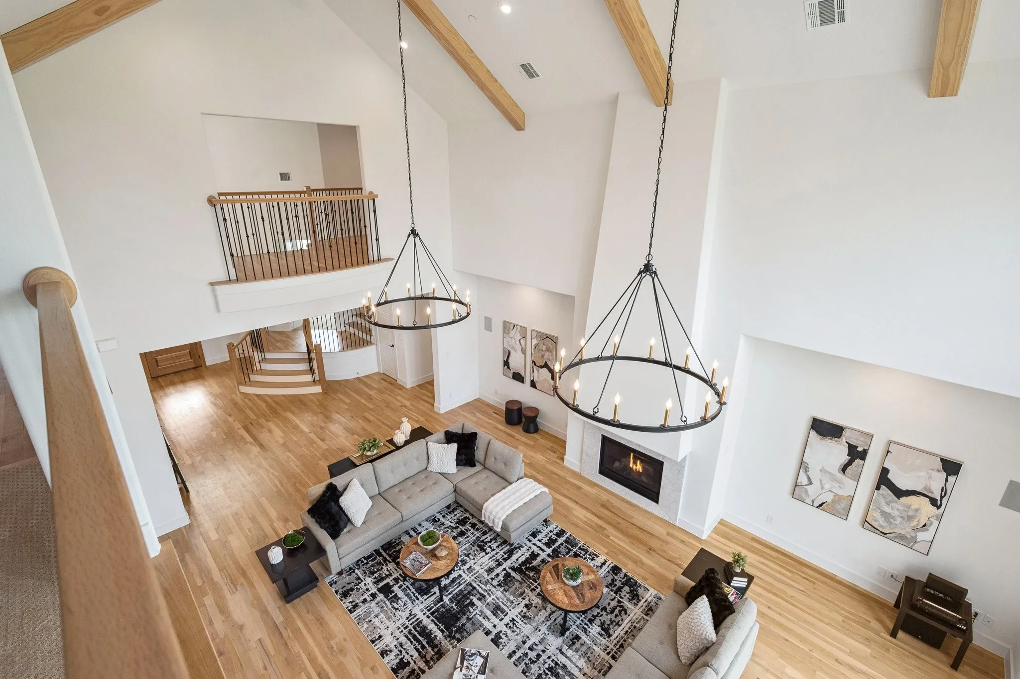 Looking down into the living room from the upstairs game room