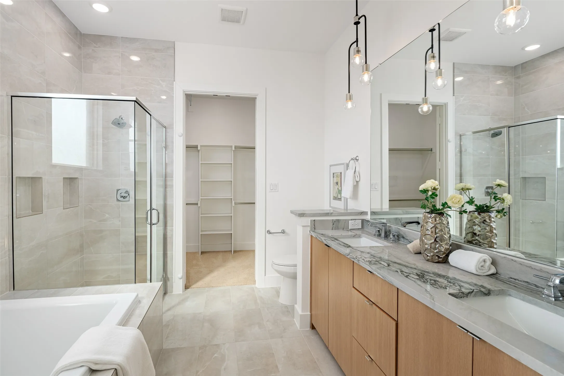 Jr. primary ensuite with dual sinks, separate shower and tub