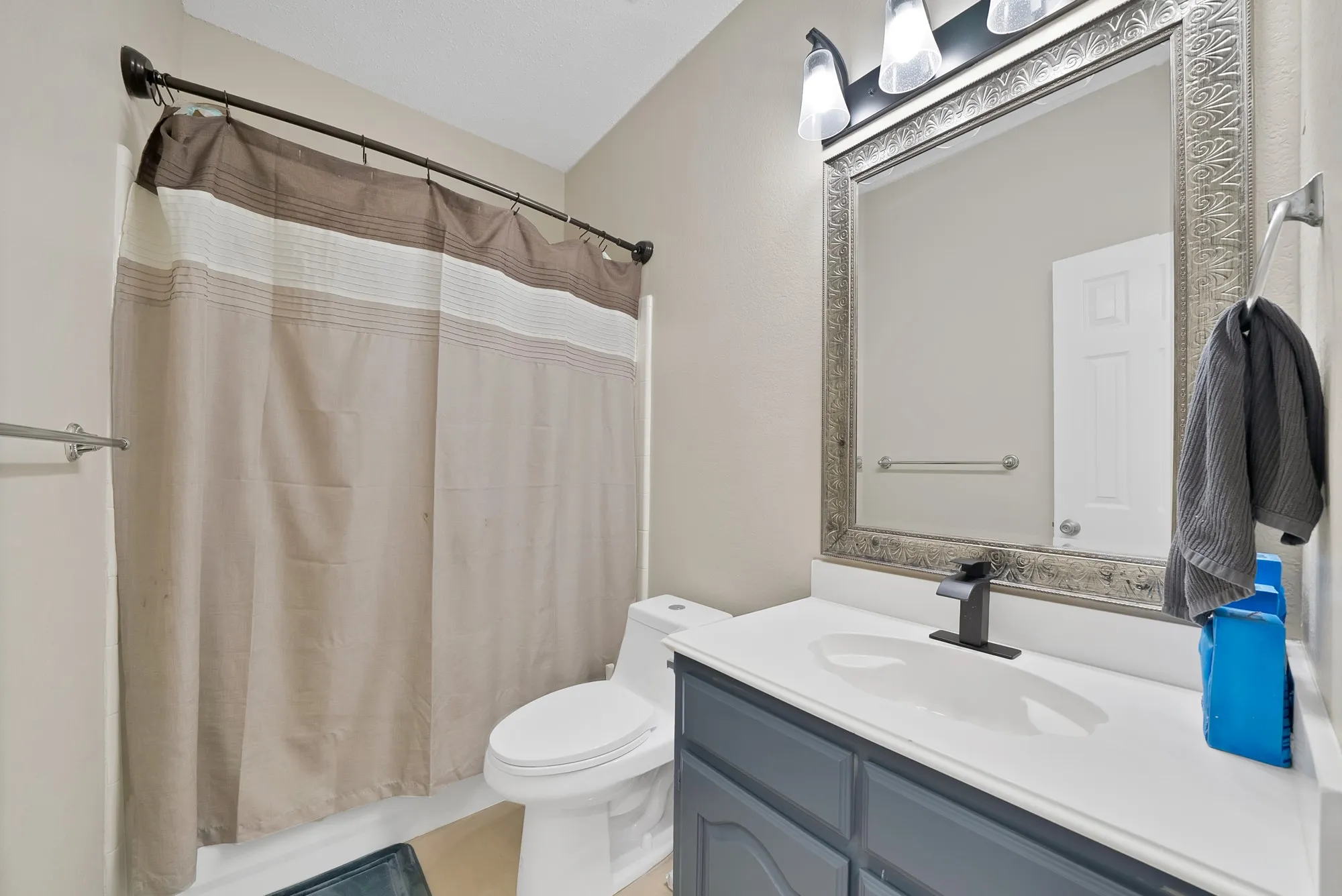 Bathroom featuring vanity and a shower with curtain