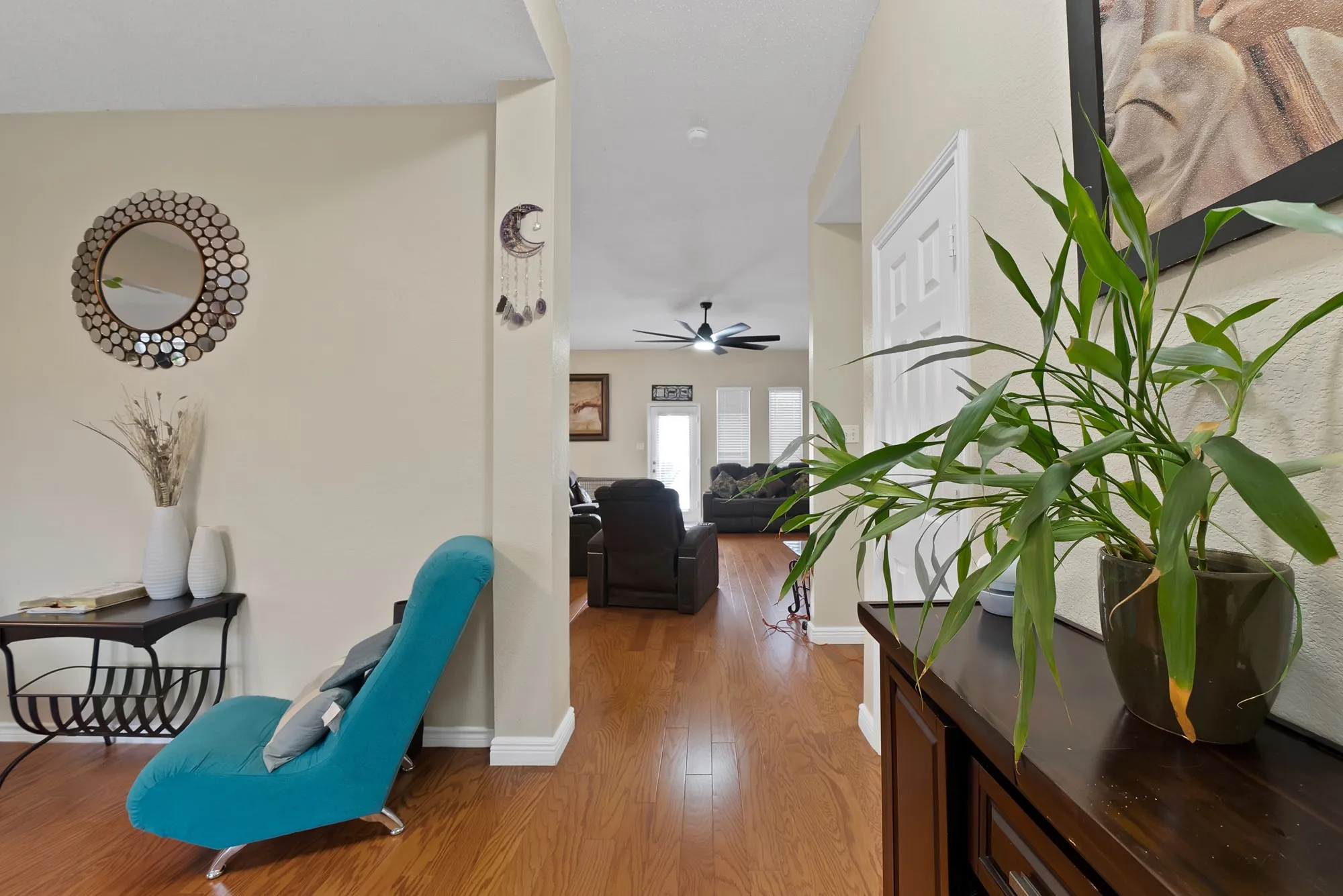 Hall with wood finished floors and baseboards