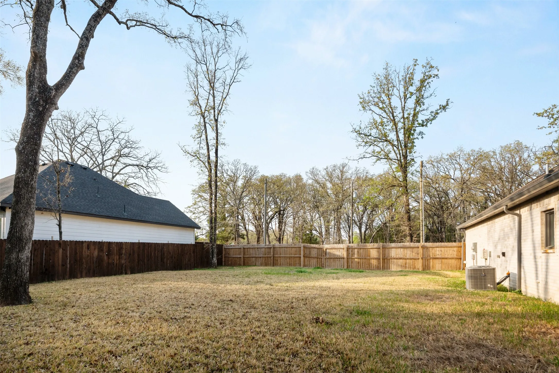 Extra lot fenced to make large backyard.