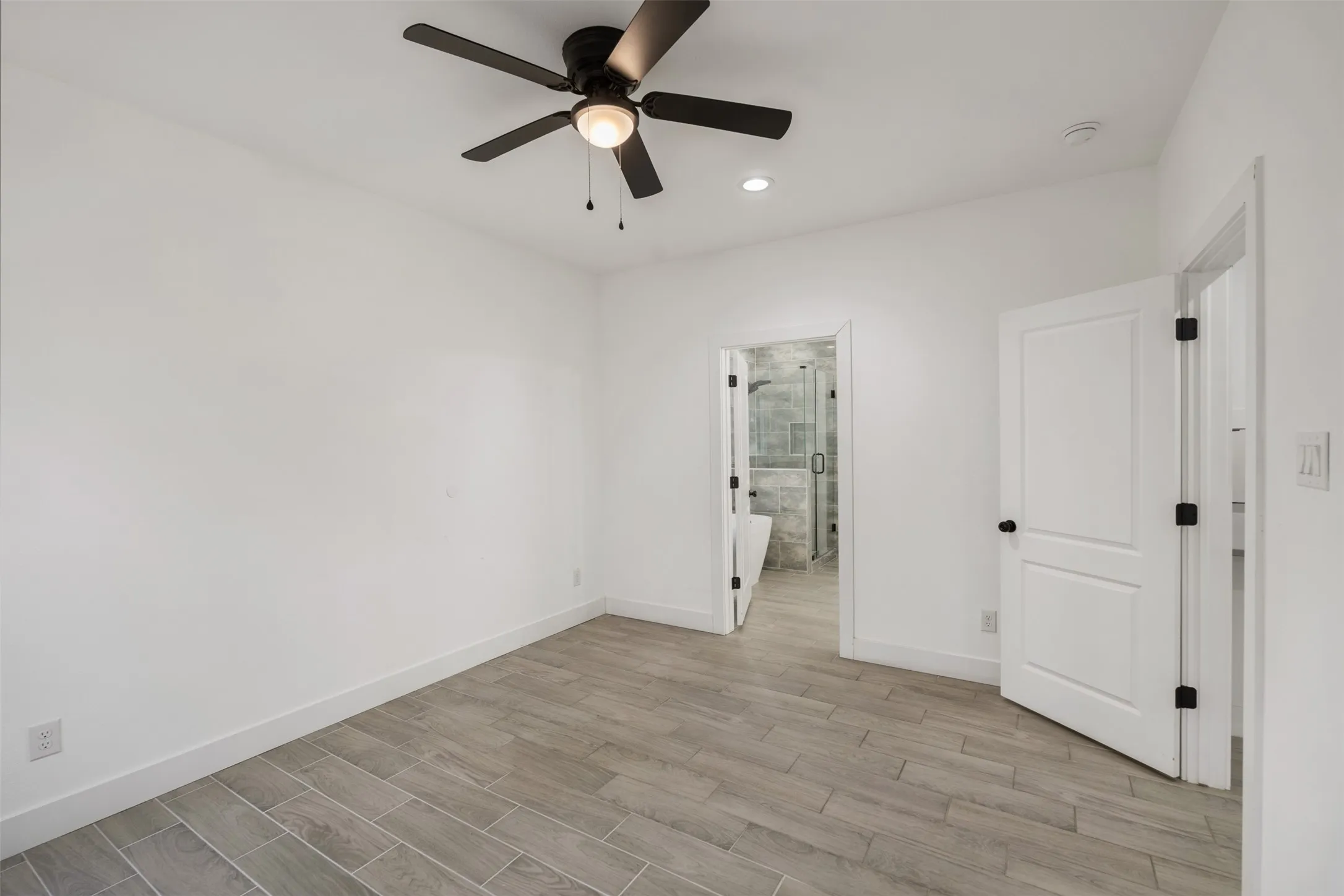 Primary bedroom with ensuite bath and separated from other bedrooms