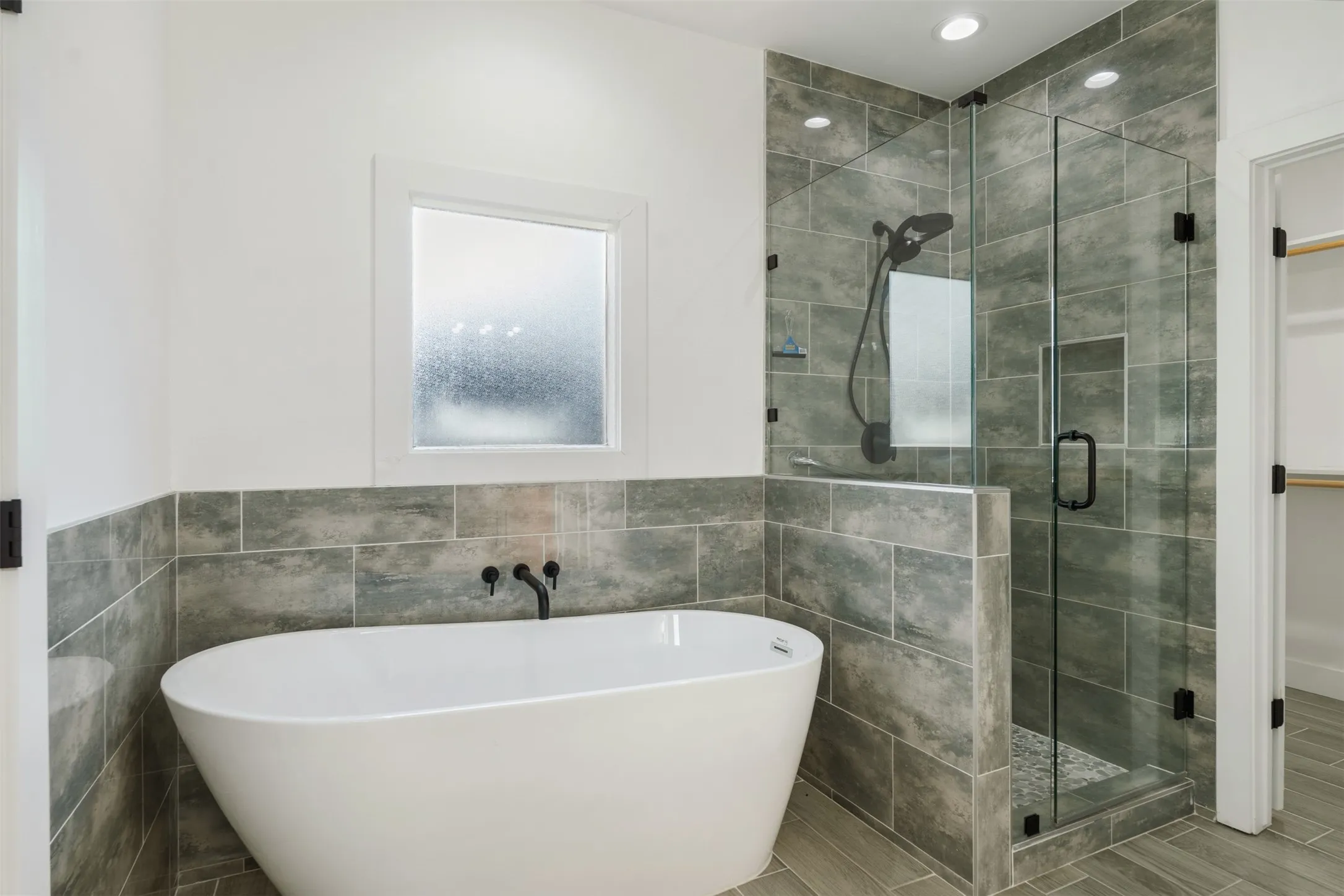 primary bath with separate soaking tub and shower