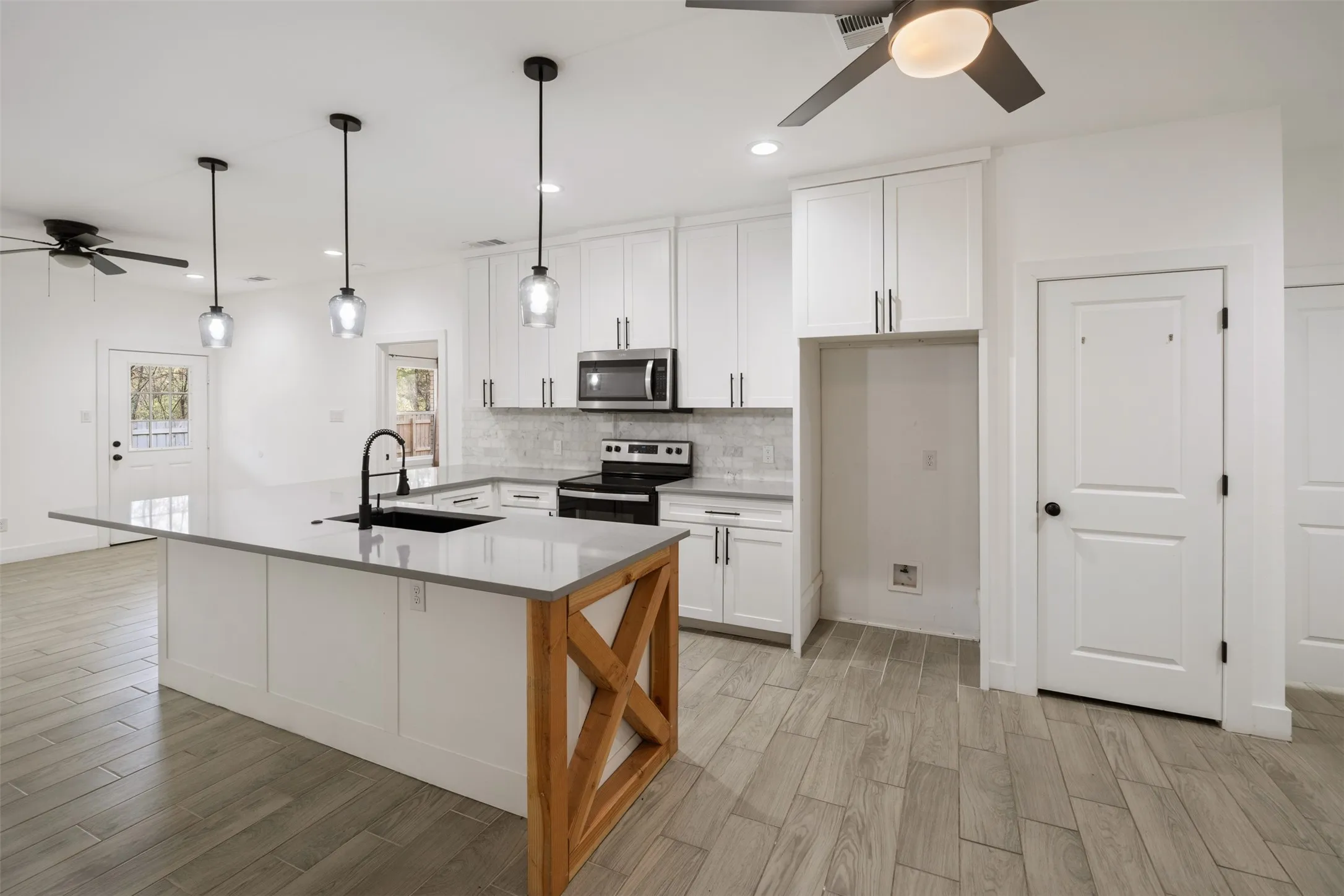  Kitchen with farmhouse sink and room for barstools