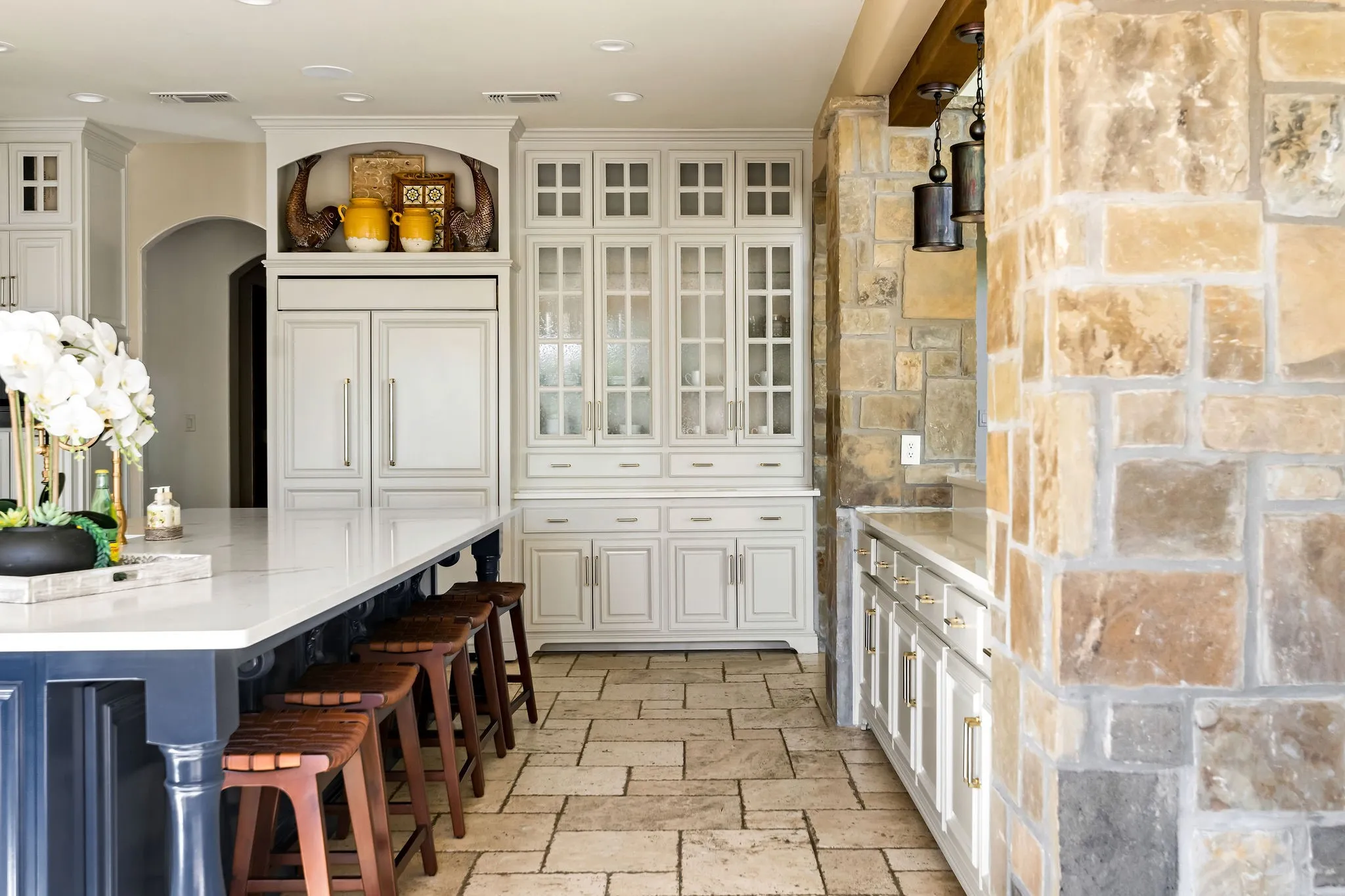The main house kitchen offers elegant finishes, a large island, and premium appliances designed for both style and function.