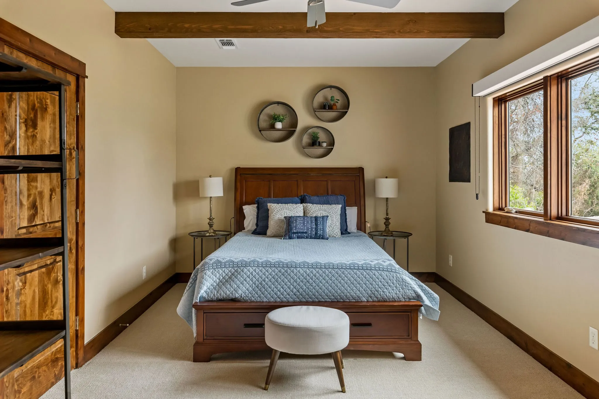 This upstairs bedroom with en suite in the main residence brings it own allure with beamed ceilings and natural lighting.