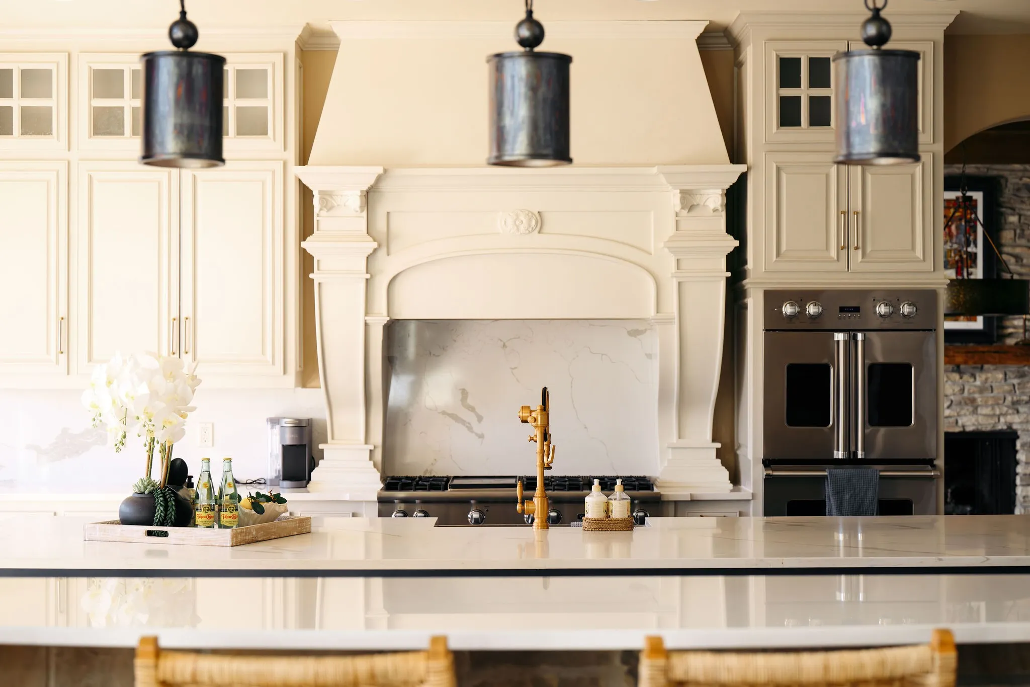 The Main House kitchen offers elegant finishes, a large island, and premium appliances designed for both style and function.