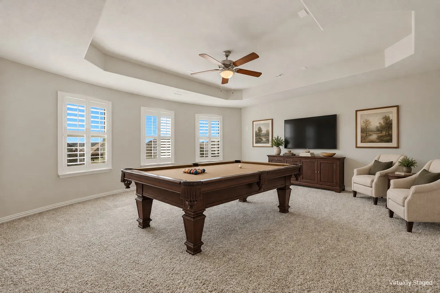 Flex room with a ceiling fan and a raised ceiling. Wired for media room and can be used as media, theater, game room, or additional bedroom!