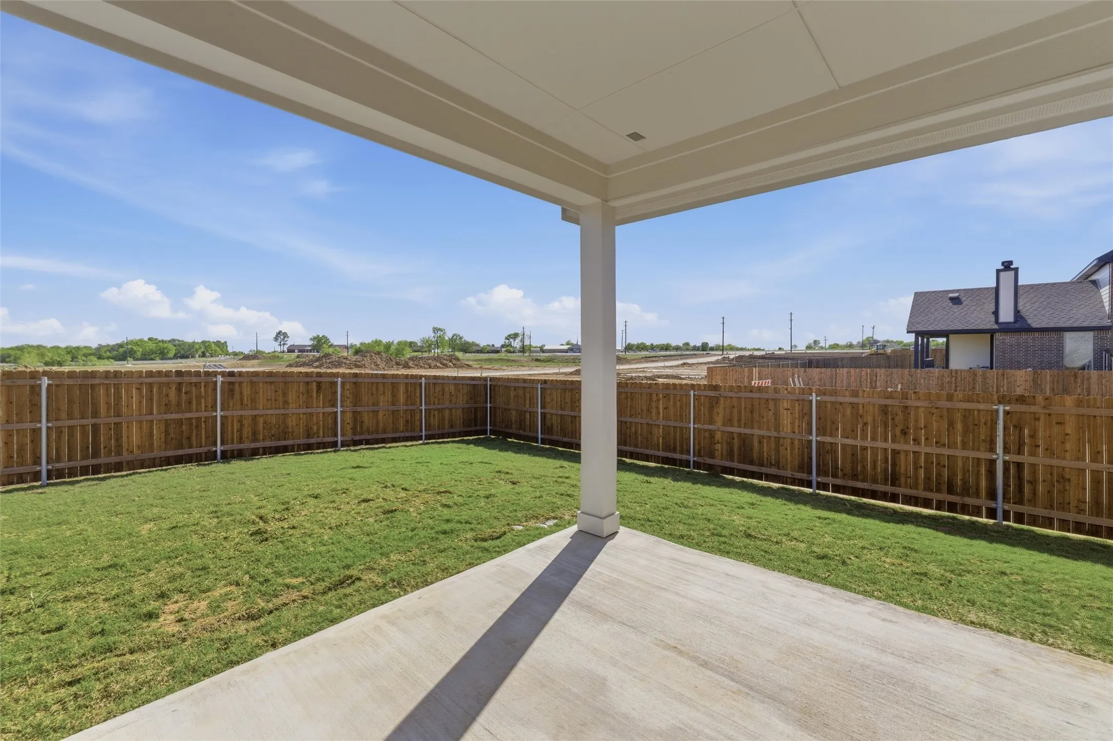 Fenced backyard featuring a patio area