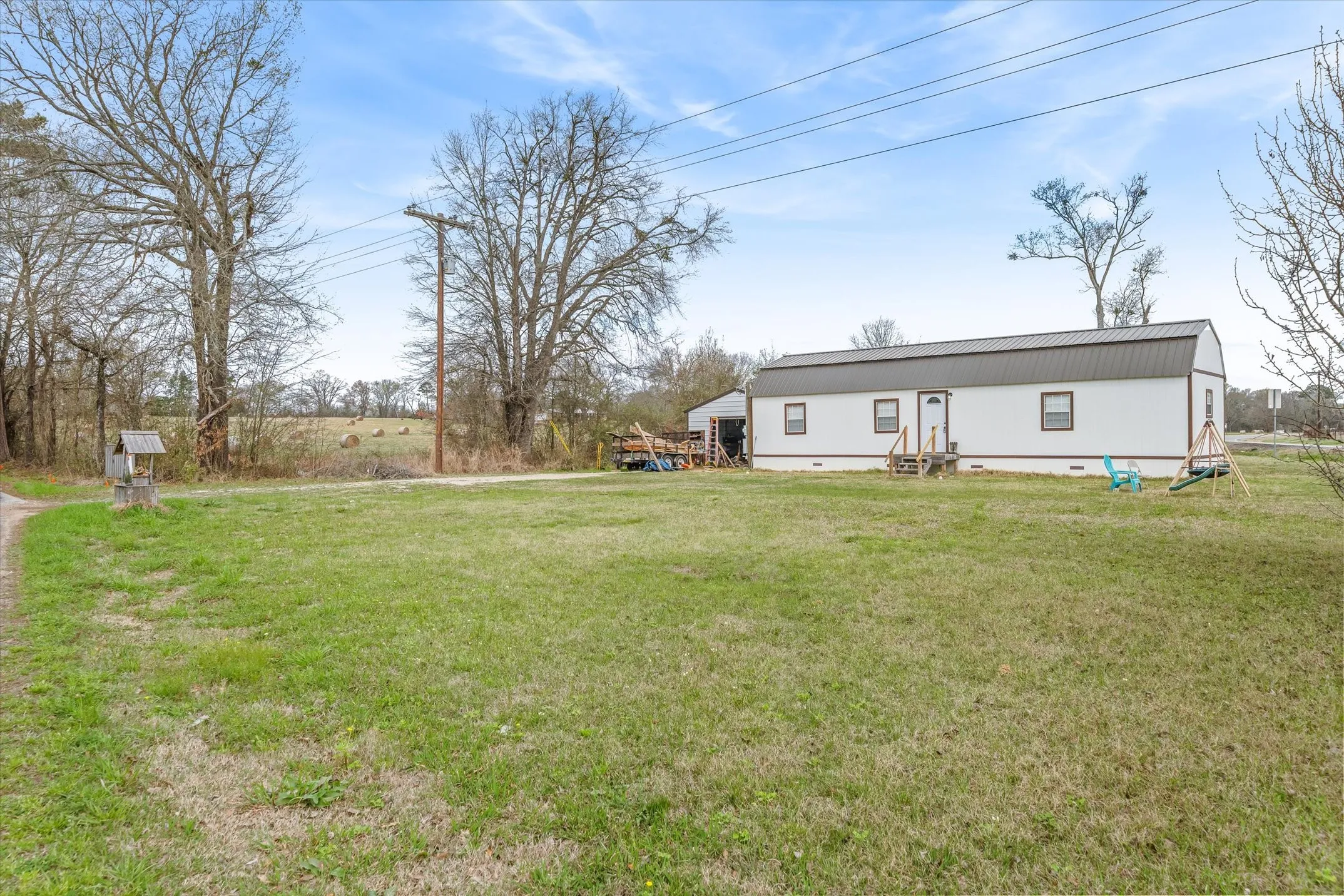 Front of property featuring a yard, crawl space, and entry steps