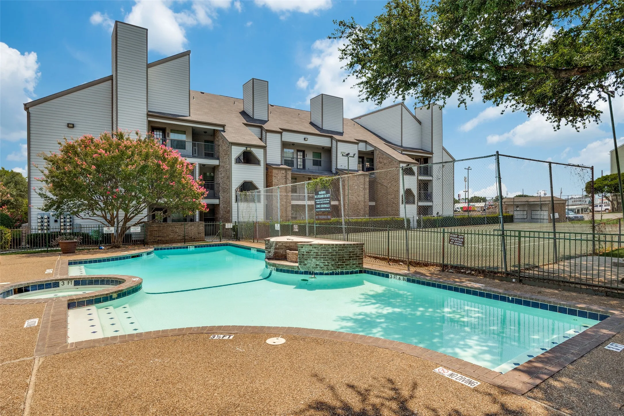 Combined pool / hot tub featuring a patio