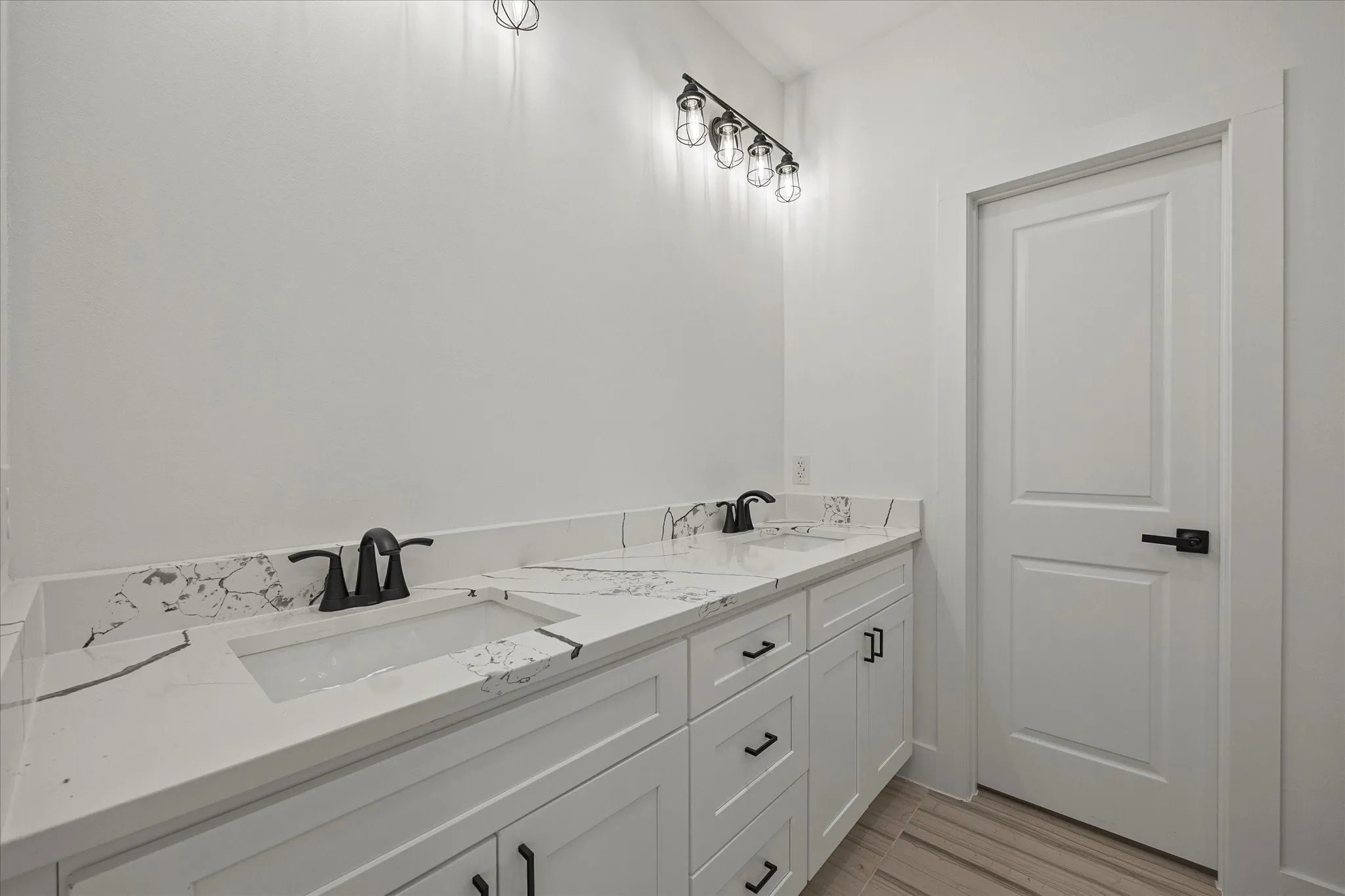 Full bath featuring double vanity