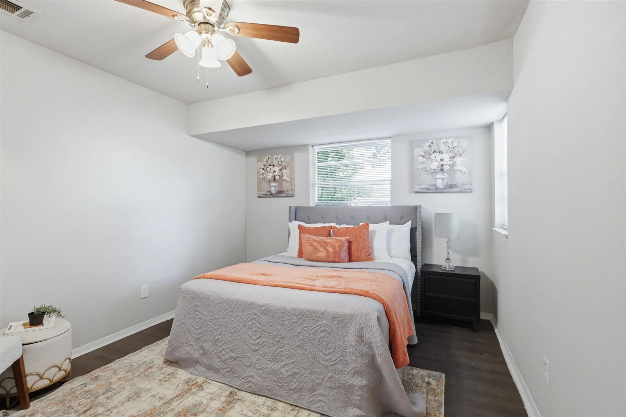 Primary Bedroom with laminate floors and ceiling fan.