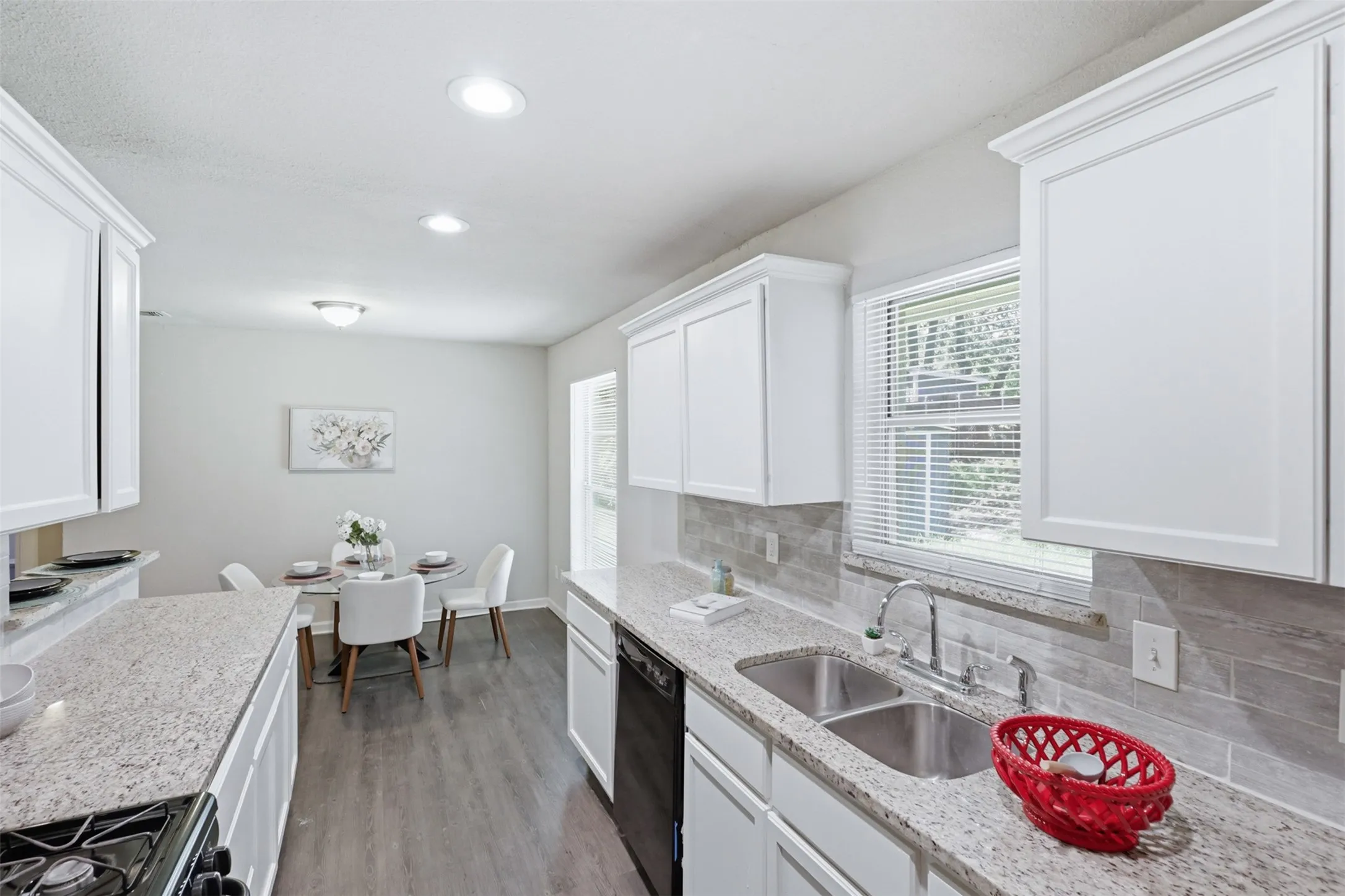 Shaker Style Painted Cabinetry with clean lines gives the kitchen a fresh modern look.