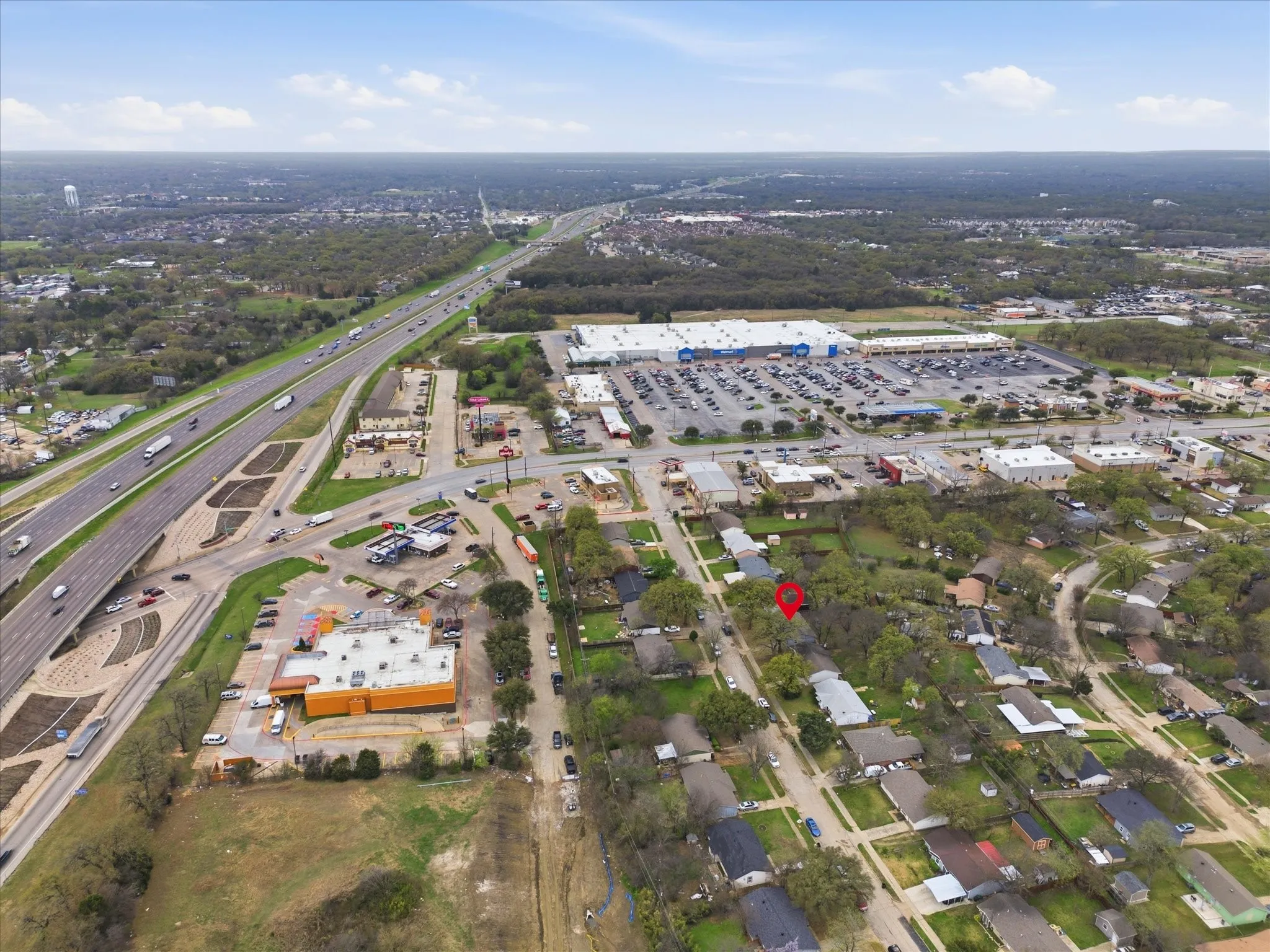 Aerial view of the neighborhood showing close proximity to I-635 for ease of commute.