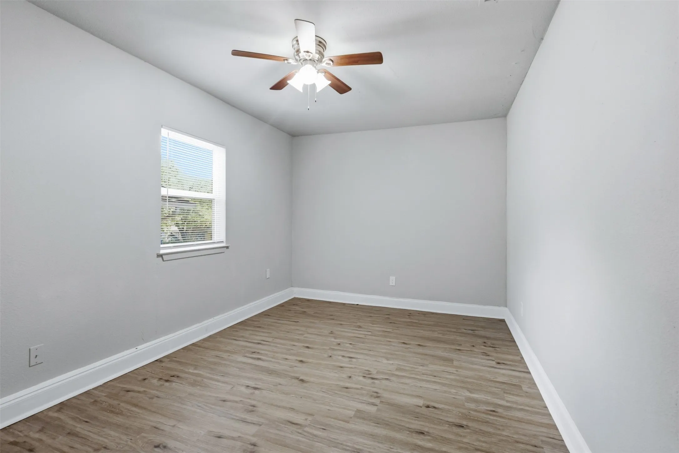 Converted garage is perfect for game room, media room or additional bedroom.