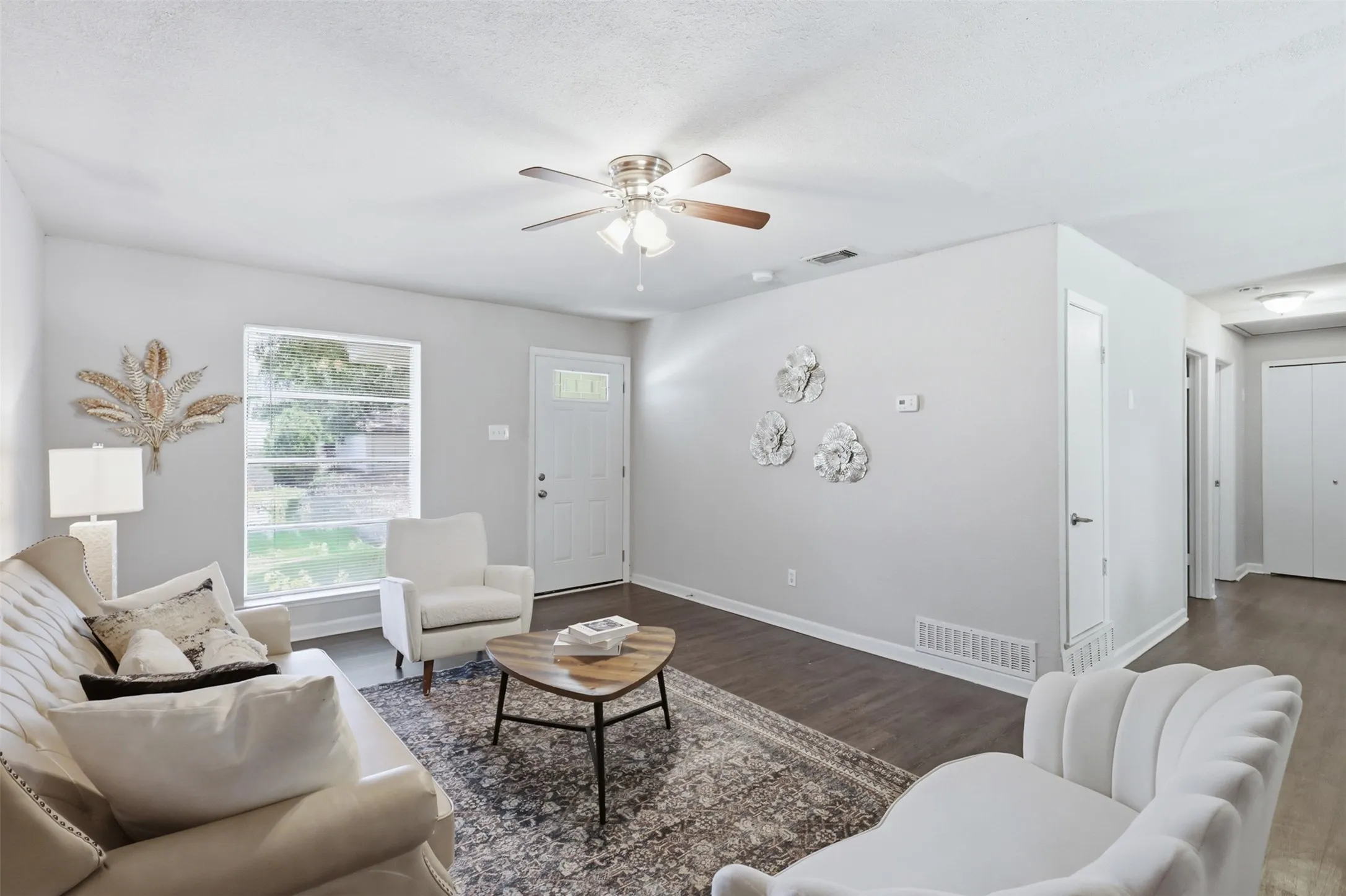 Plenty of space in the living room for an entertainment center and comfortable seating area.