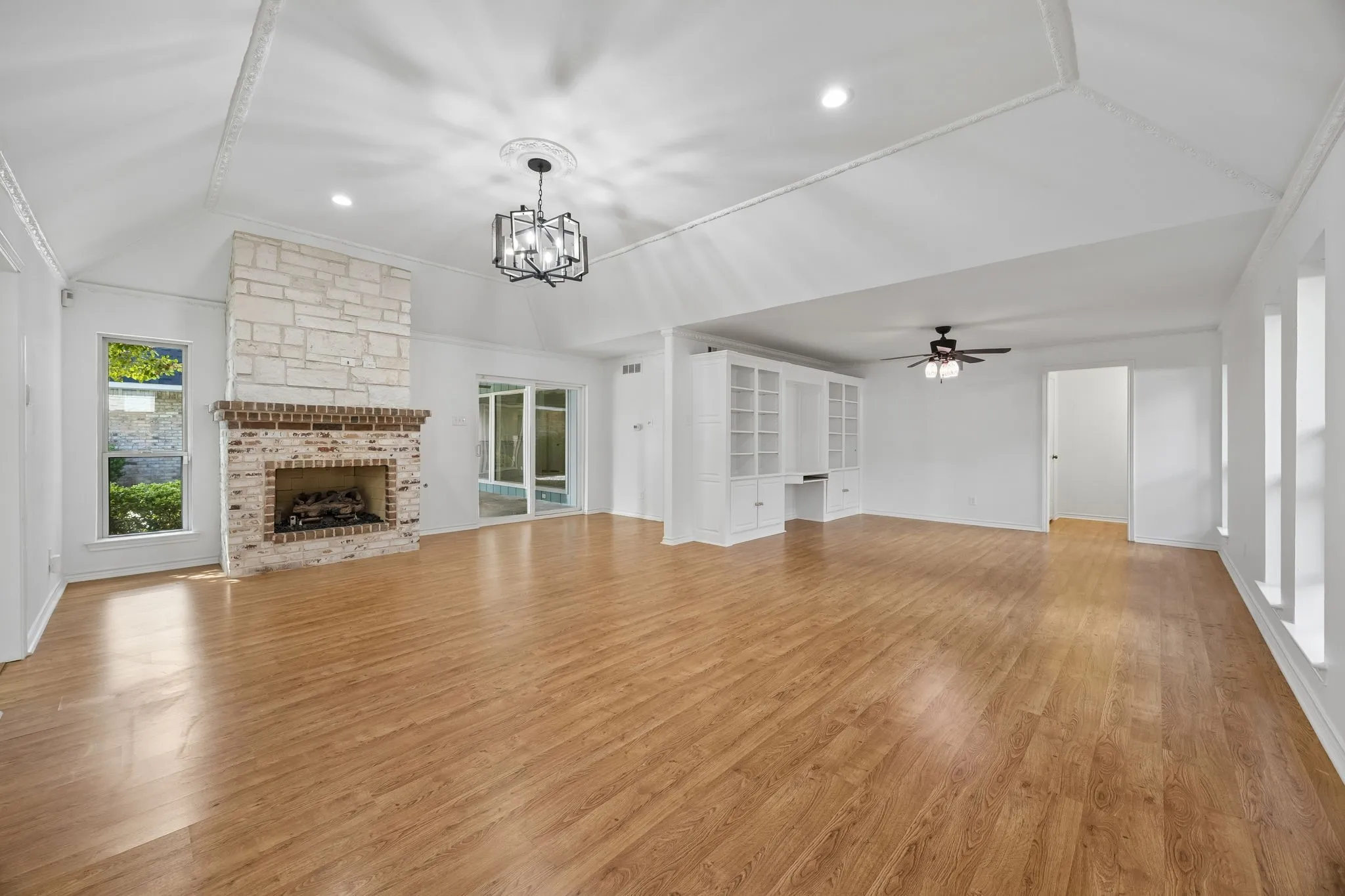 Primary bedroom has a fire place and built in desk