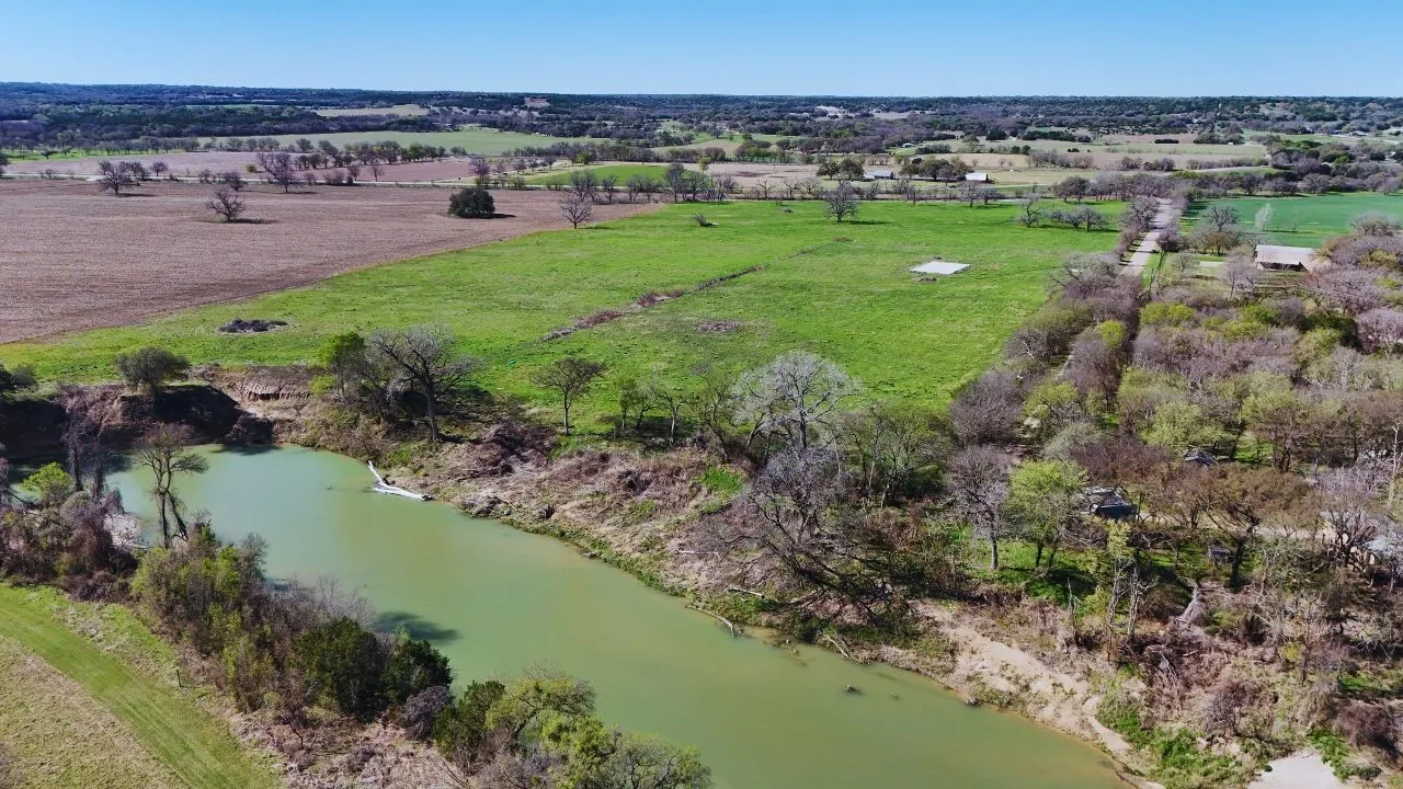View of rural area featuring a nearby body of water