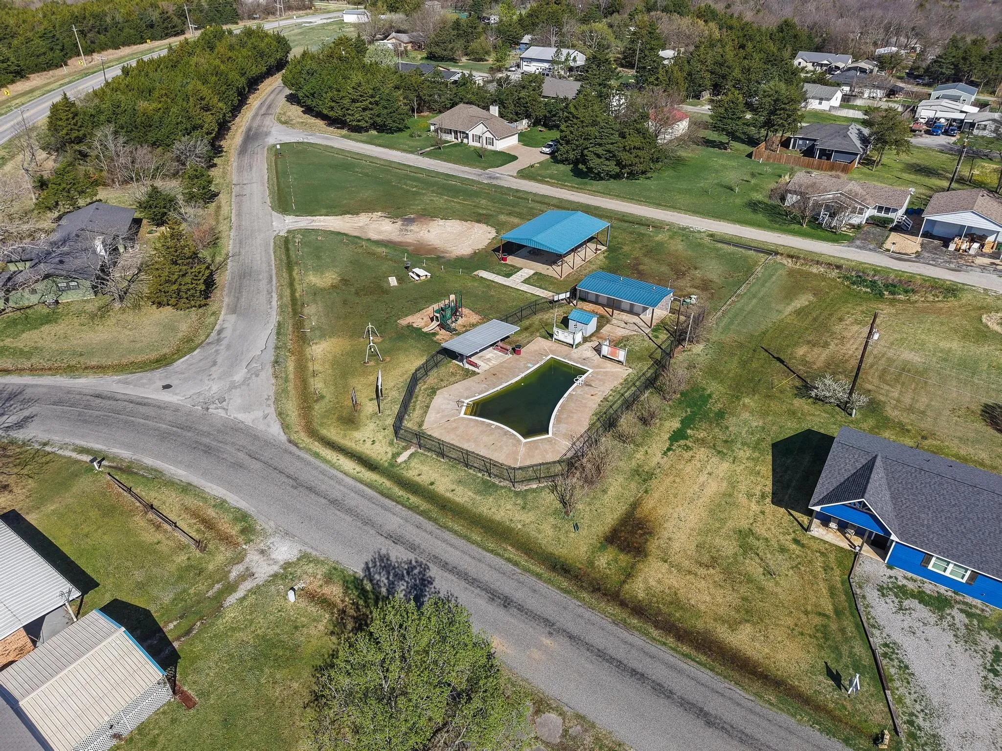 Aerial overview of property's location featuring nearby suburban area