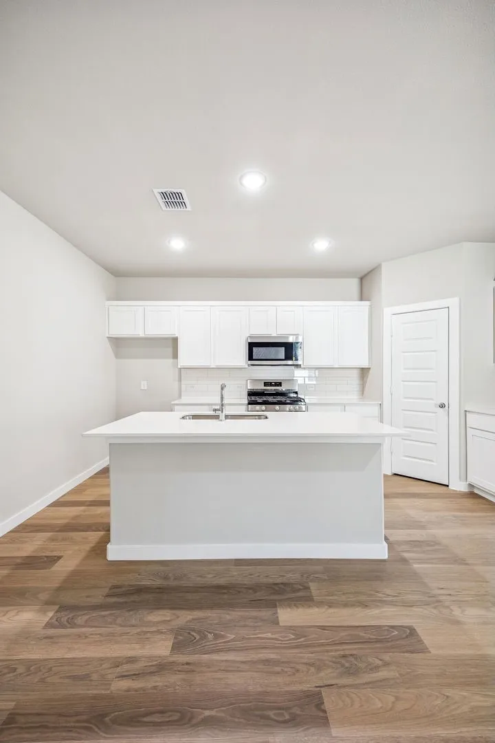 Kitchen in the Willow home plan by Trophy Signature Homes – REPRESENTATIVE PHOTO