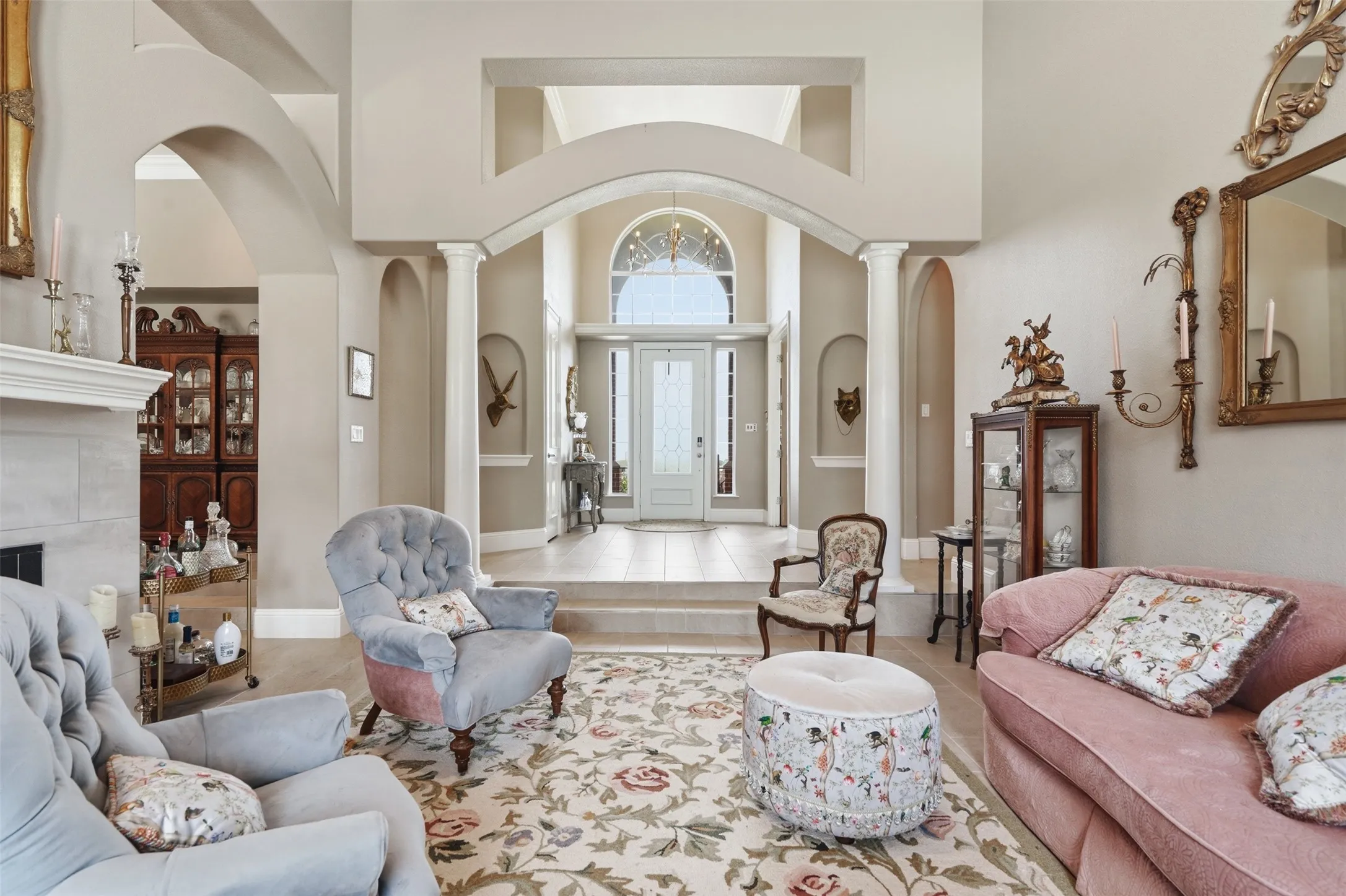 Grand foyer entry featuring an arched transom window