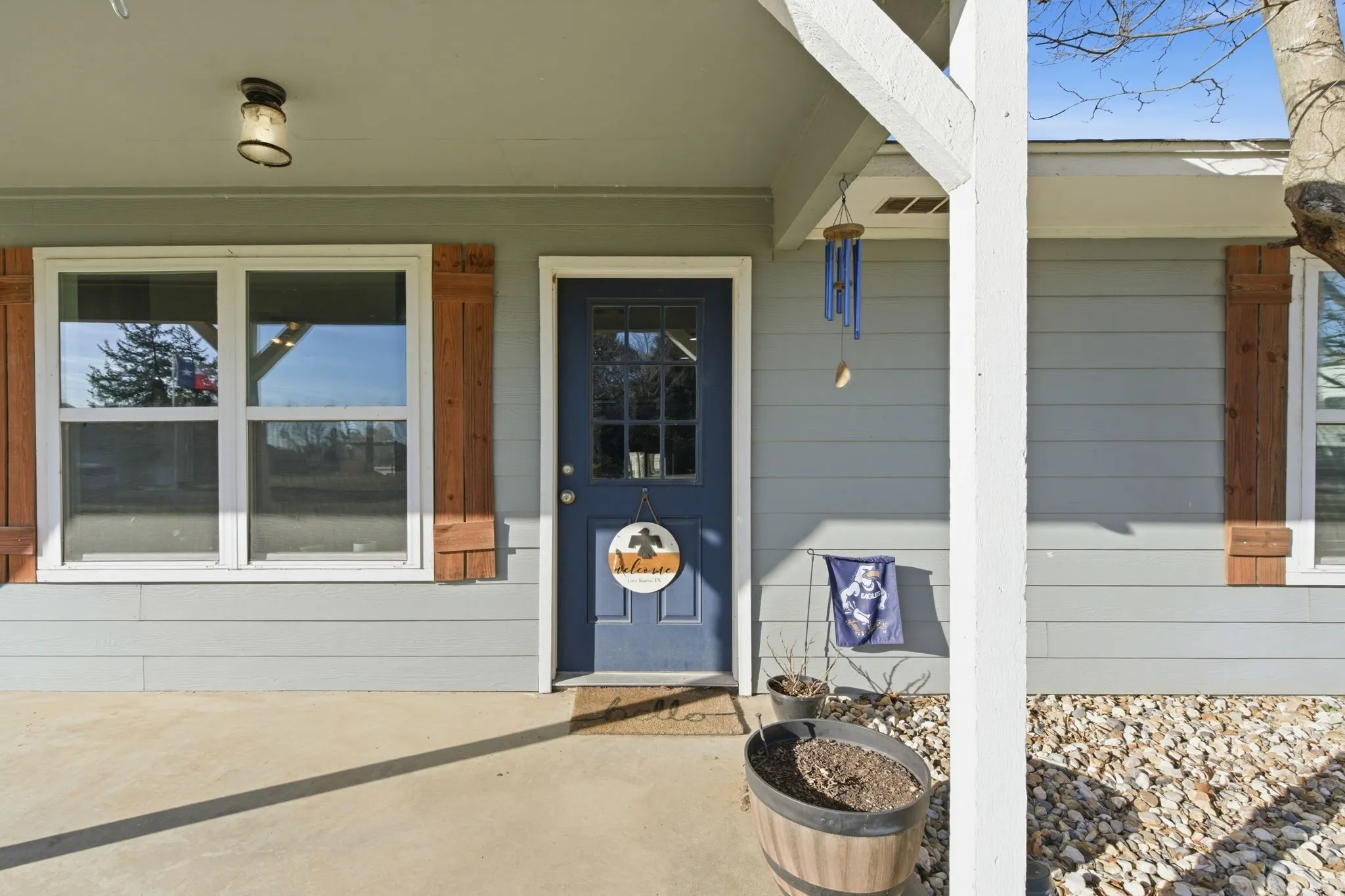 View of exterior entry with a porch