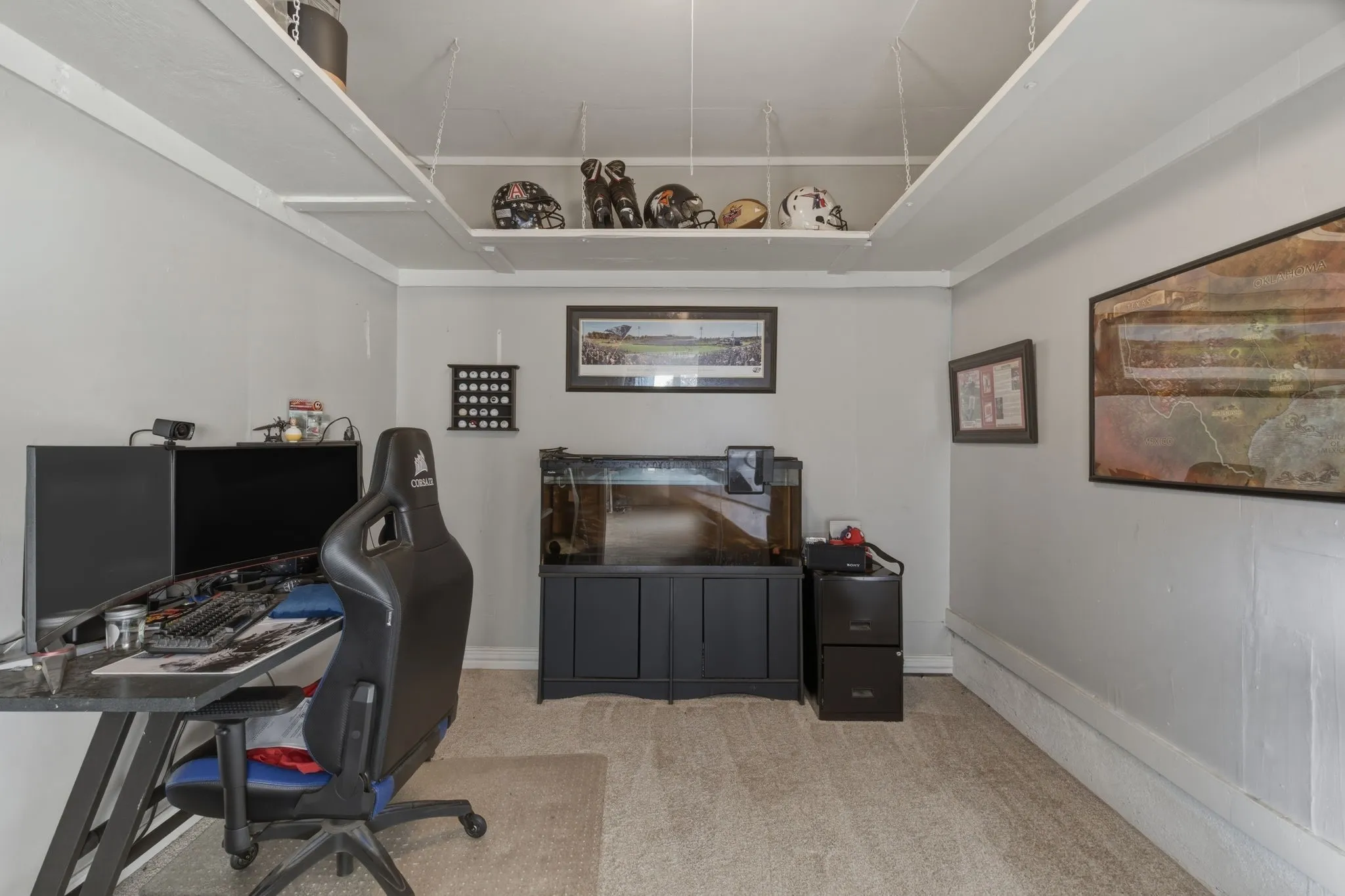 Office area featuring light colored carpet and baseboards