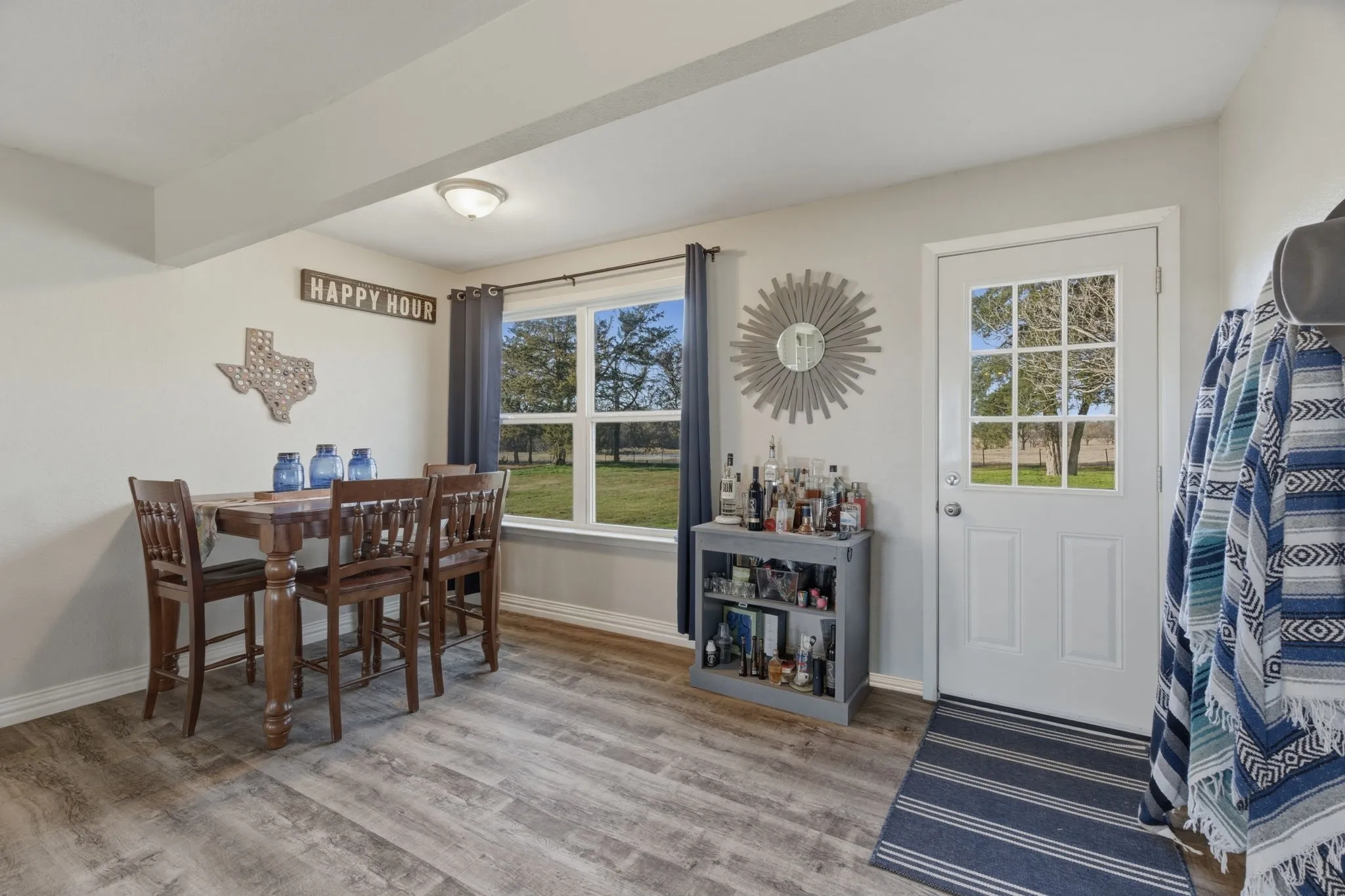 Dining room with baseboards and light wood-style floors