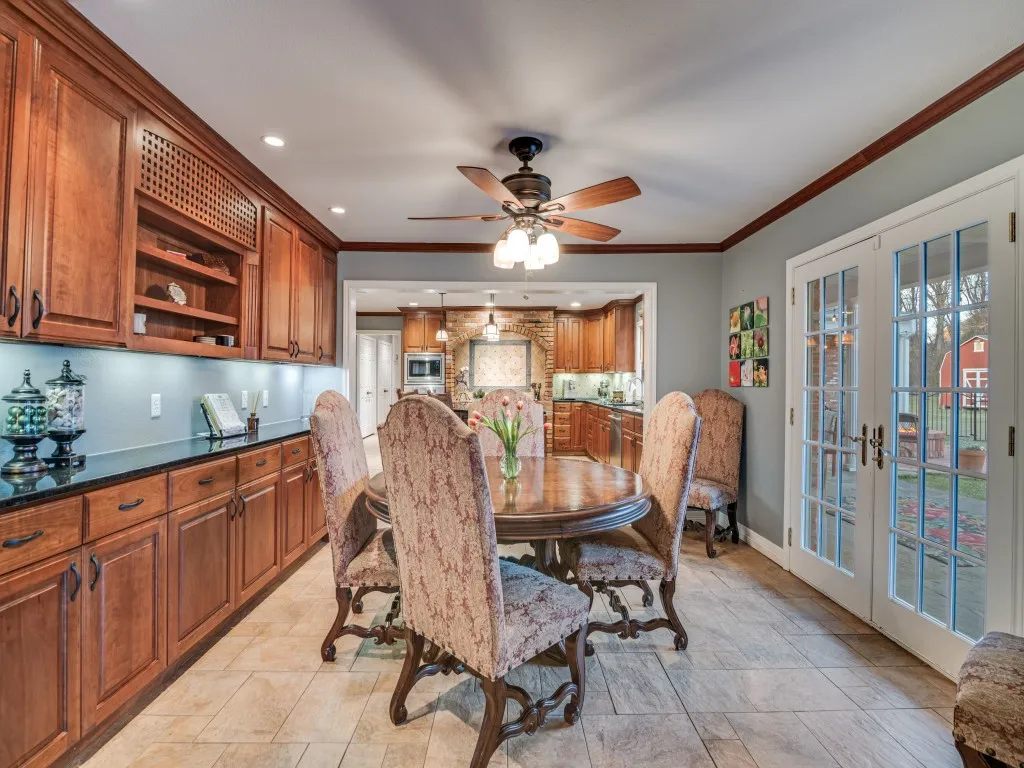 Oversized breakfast area with abundant storage space and a wonderful view of the pool and back yard.