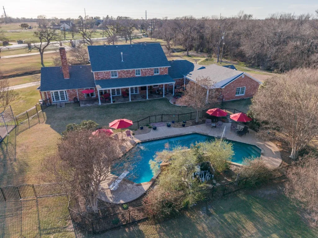 Aerial view of the pool area behind the home.