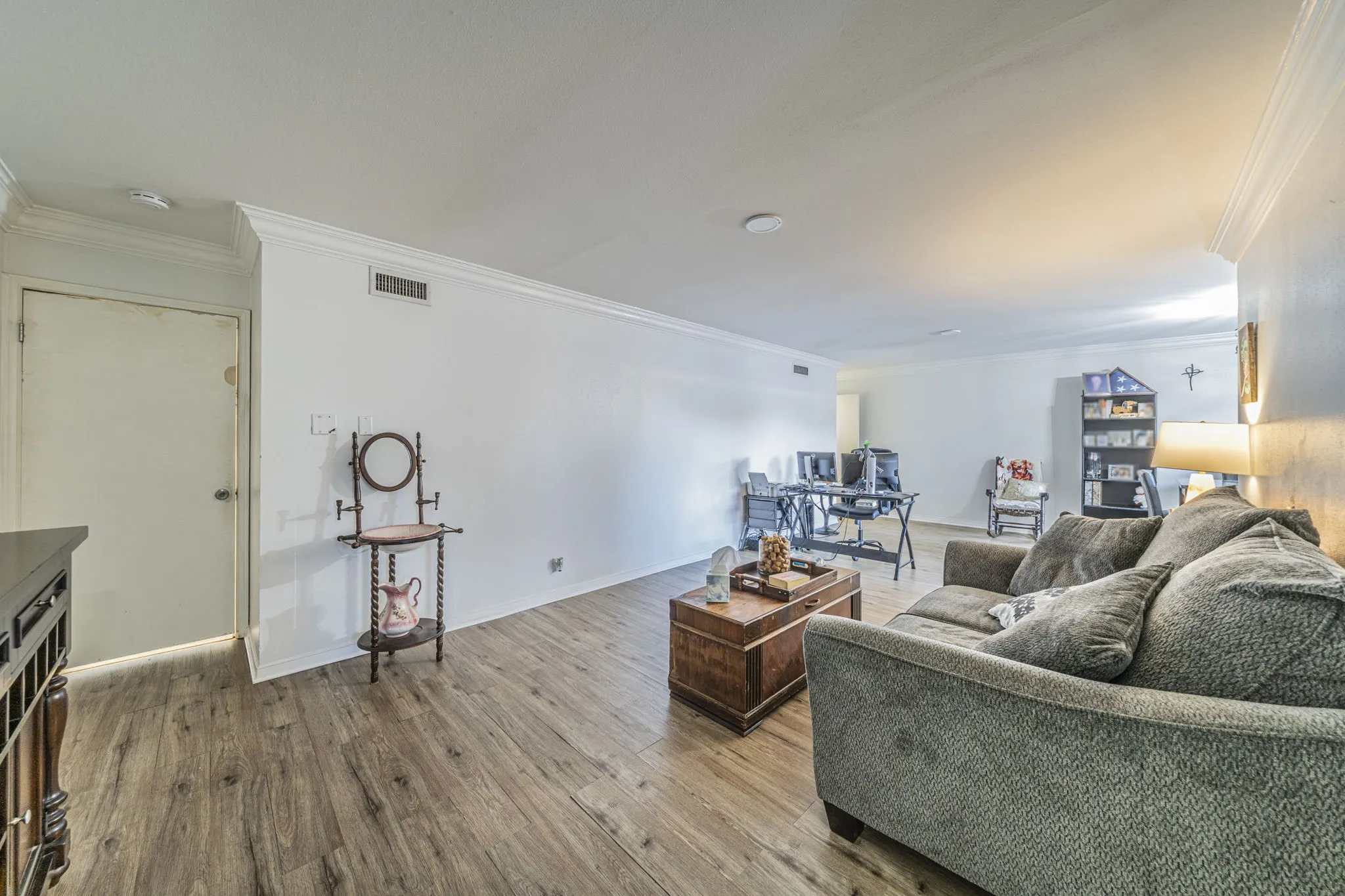 Spacious living room with luxury vinyl plank flooring.