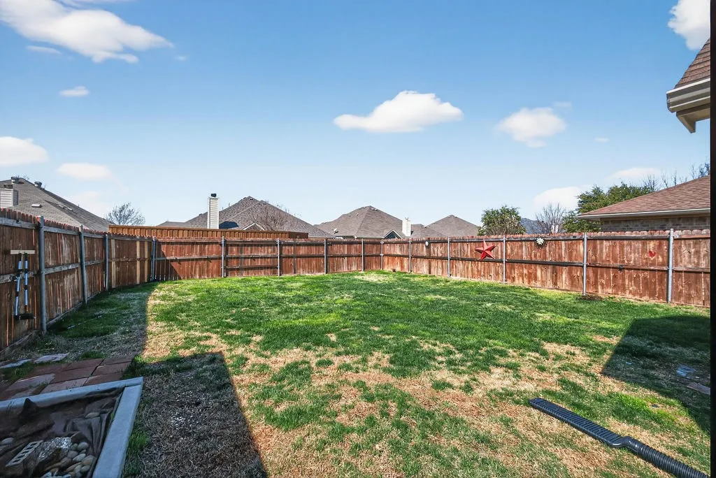 View of fenced backyard