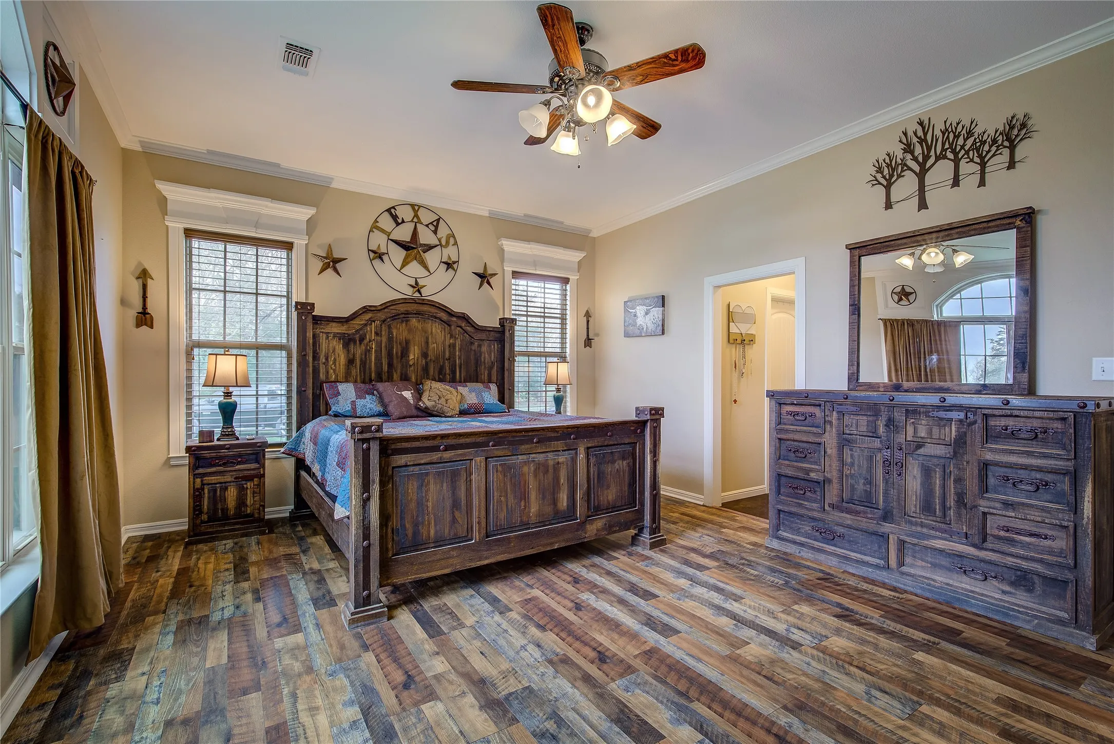 Large primary bedroom measuring 14’8” x 18’2”, featuring beautiful countryside views and a private en suite bathroom.